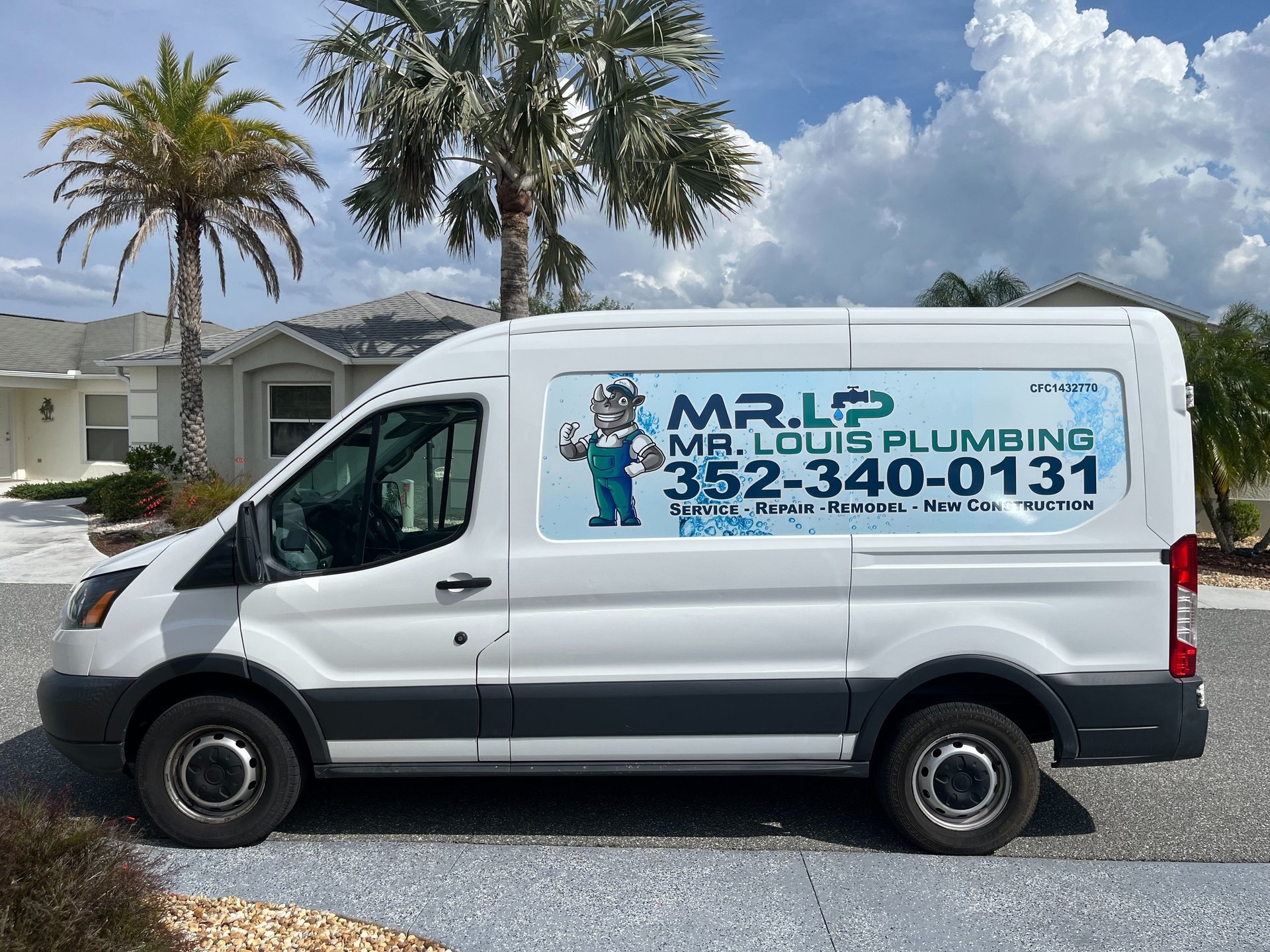 a man working on a pipe in a wall