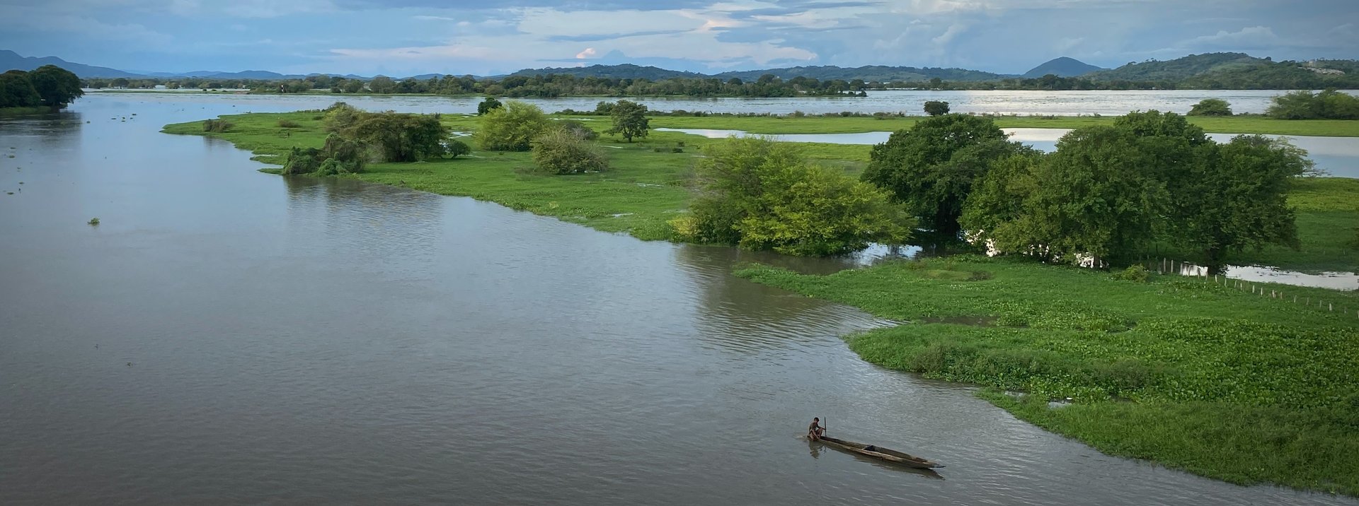 landscape photography of sea with little island between