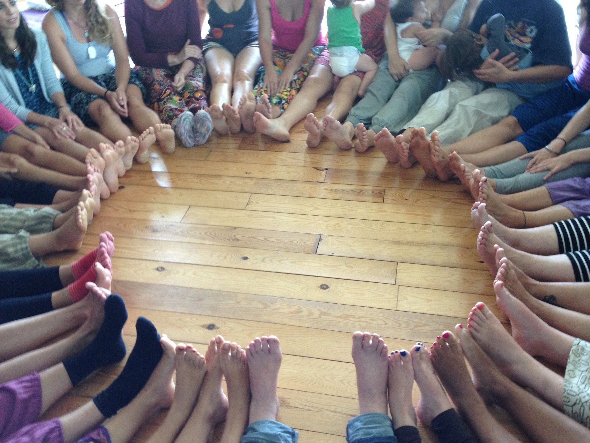 a black and white photo of a woman covering her mouth