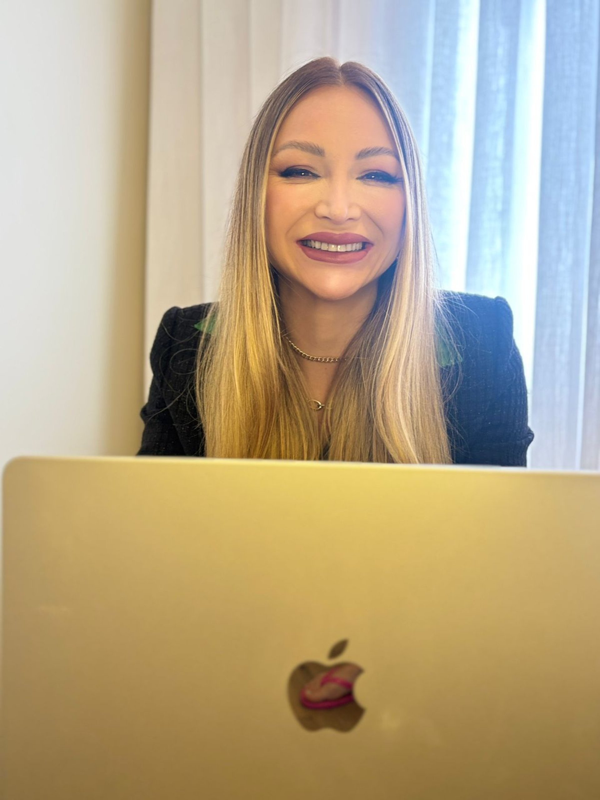 person holding amber glass bottle