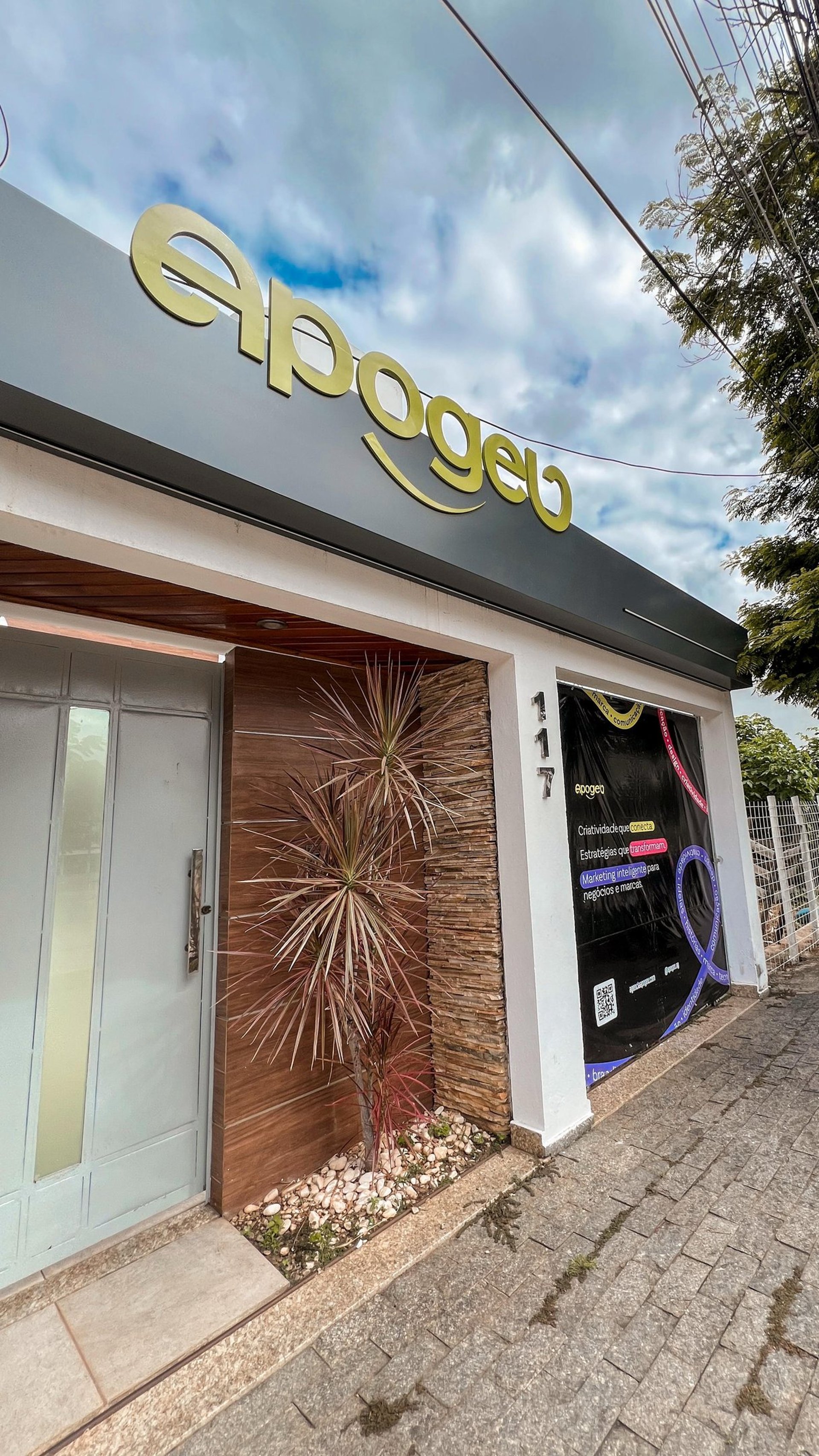 grayscale photo of people walking towards building