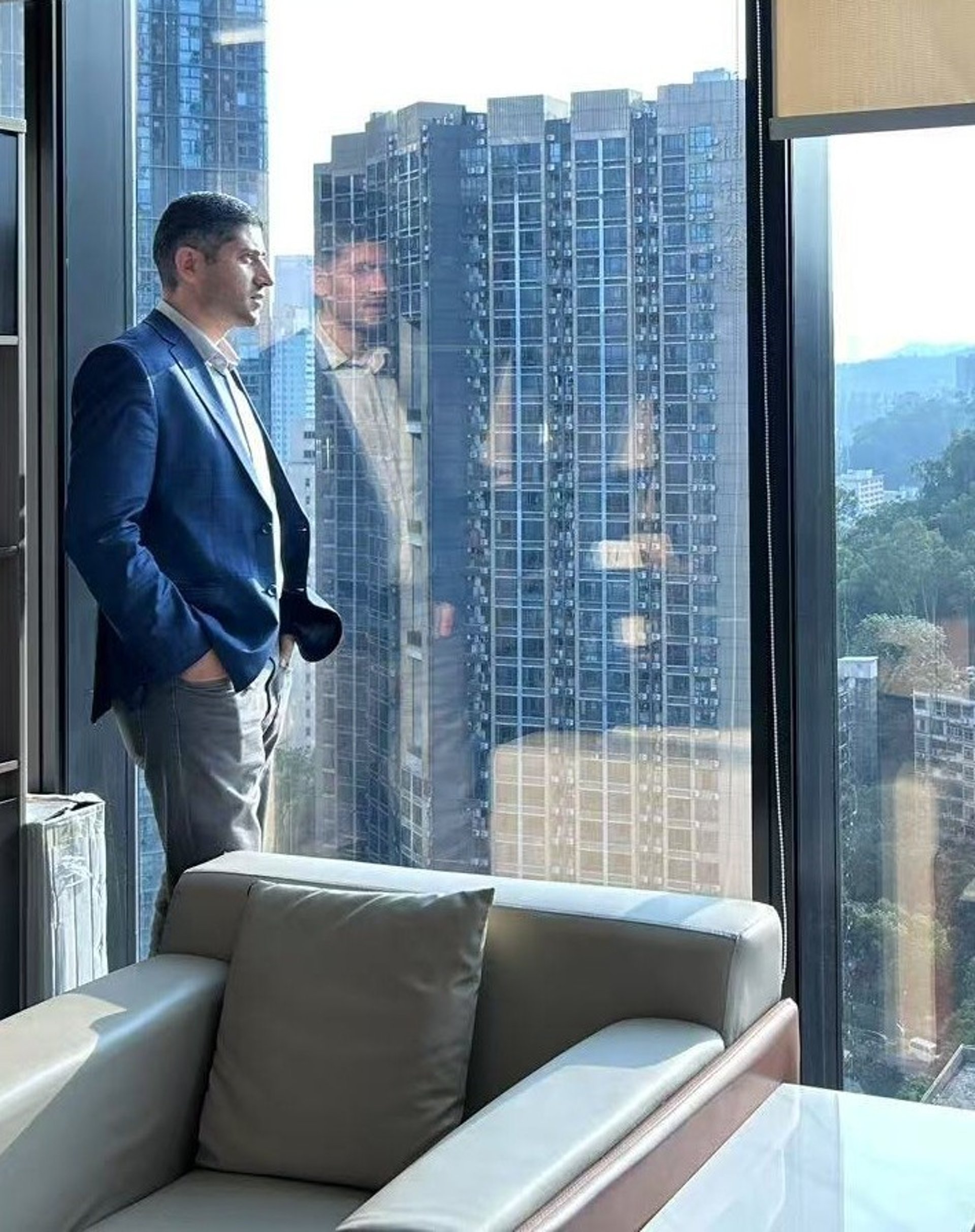 person wearing watch near laptop
