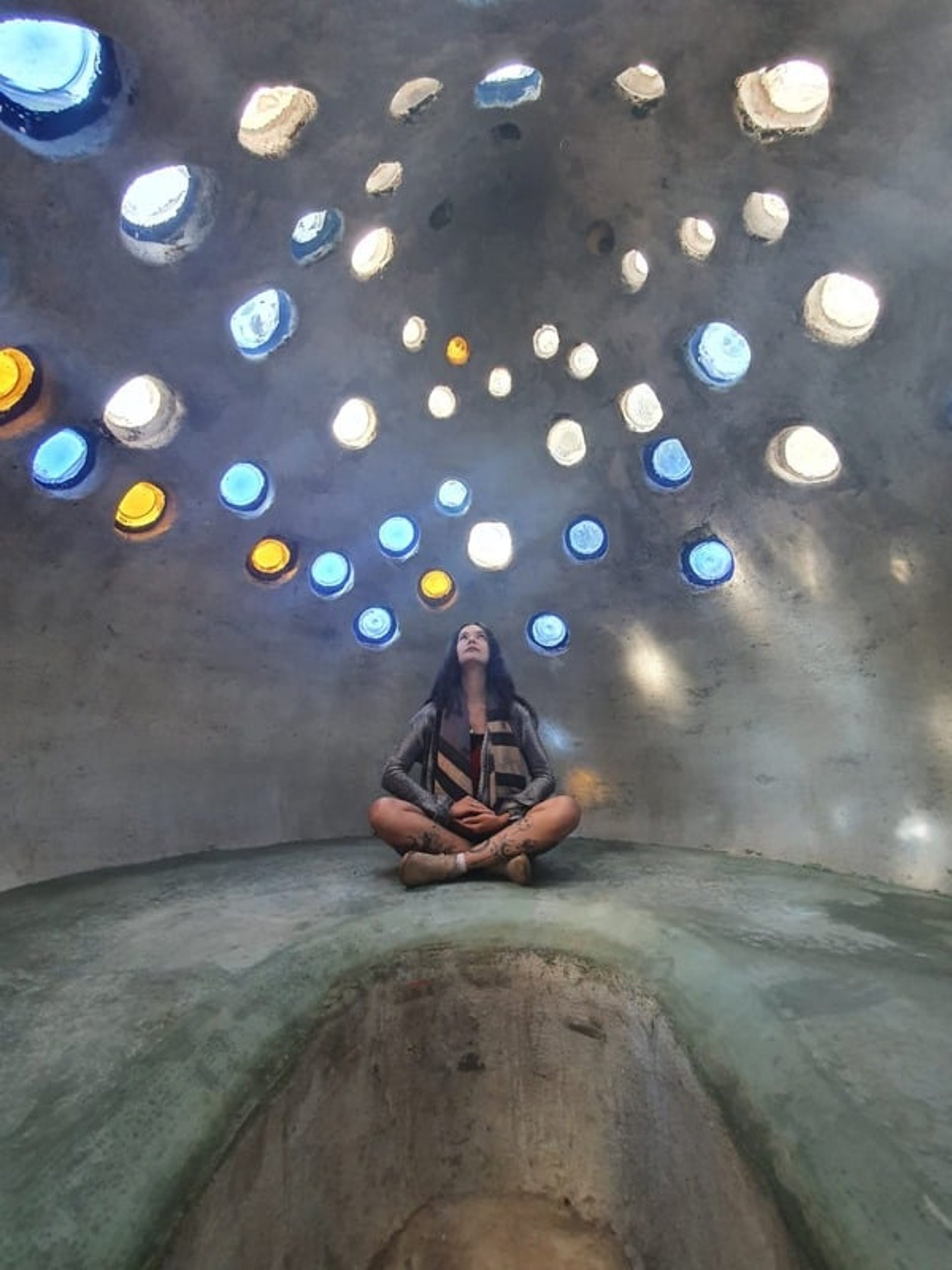 woman wearing yellow long-sleeved dress under white clouds and blue sky during daytime