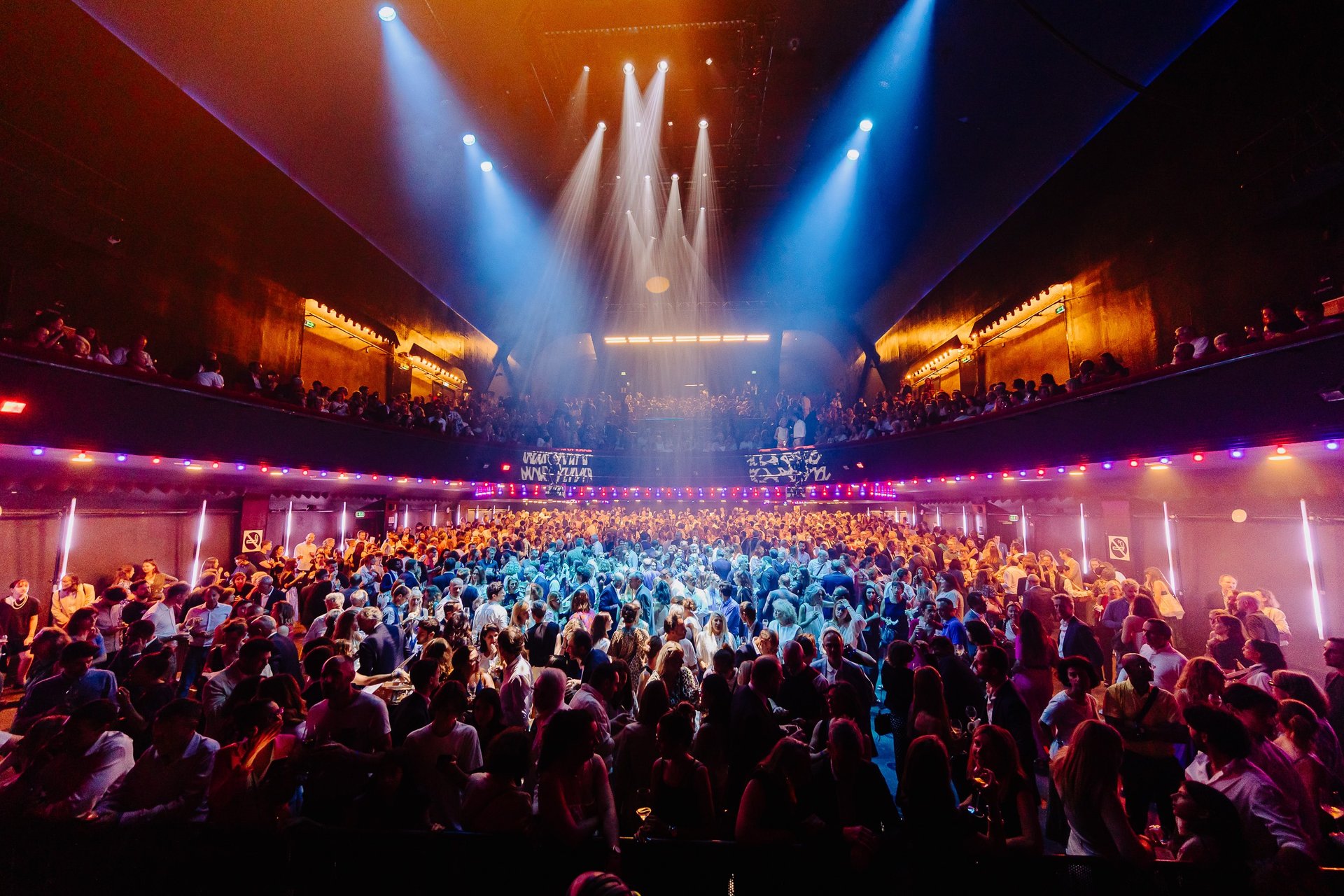 people sitting on chairs watching a game
