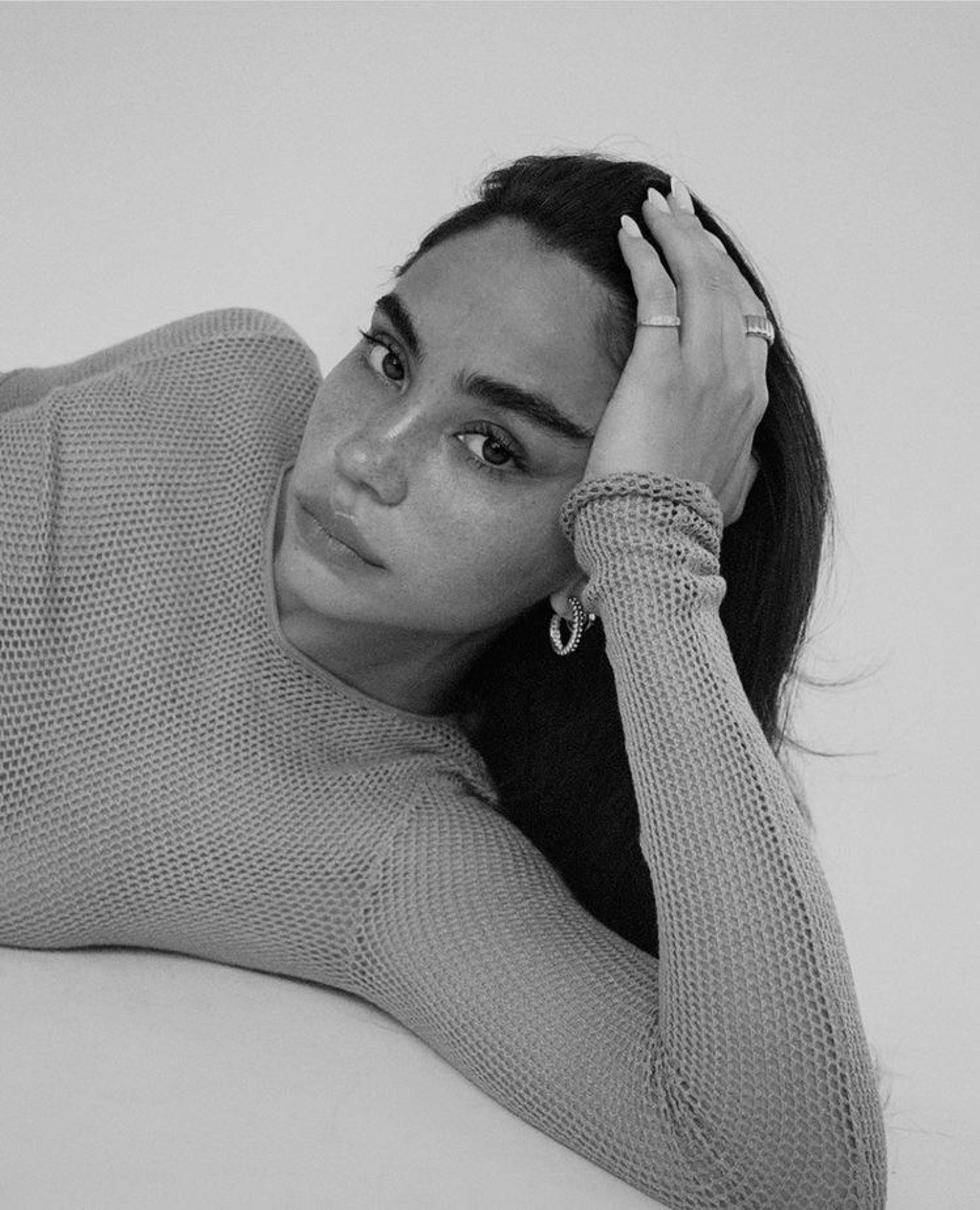 an abstract photo of a curved building with a blue sky in the background