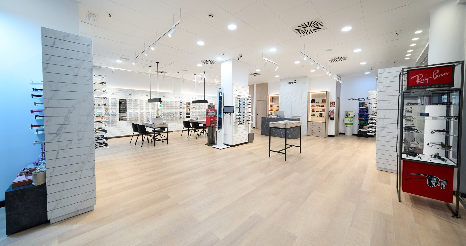 an abstract photo of a curved building with a blue sky in the background