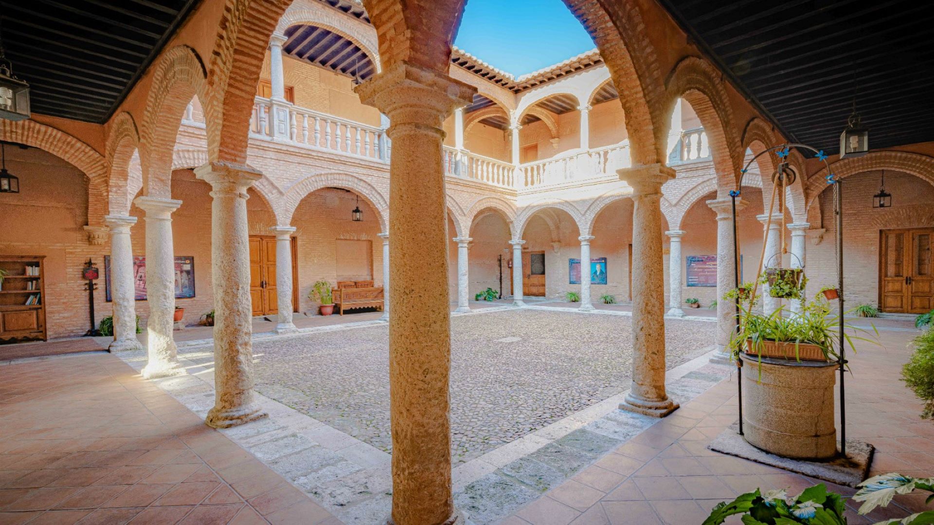 an abstract photo of a curved building with a blue sky in the background