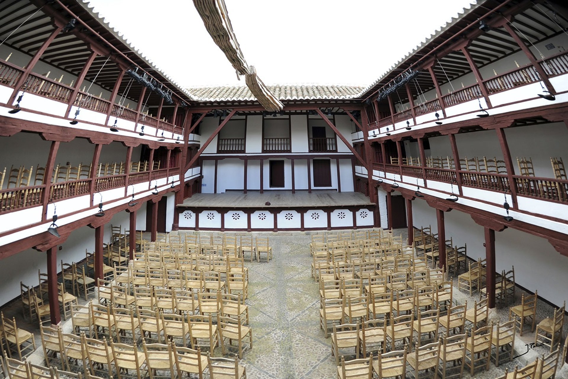 an abstract photo of a curved building with a blue sky in the background