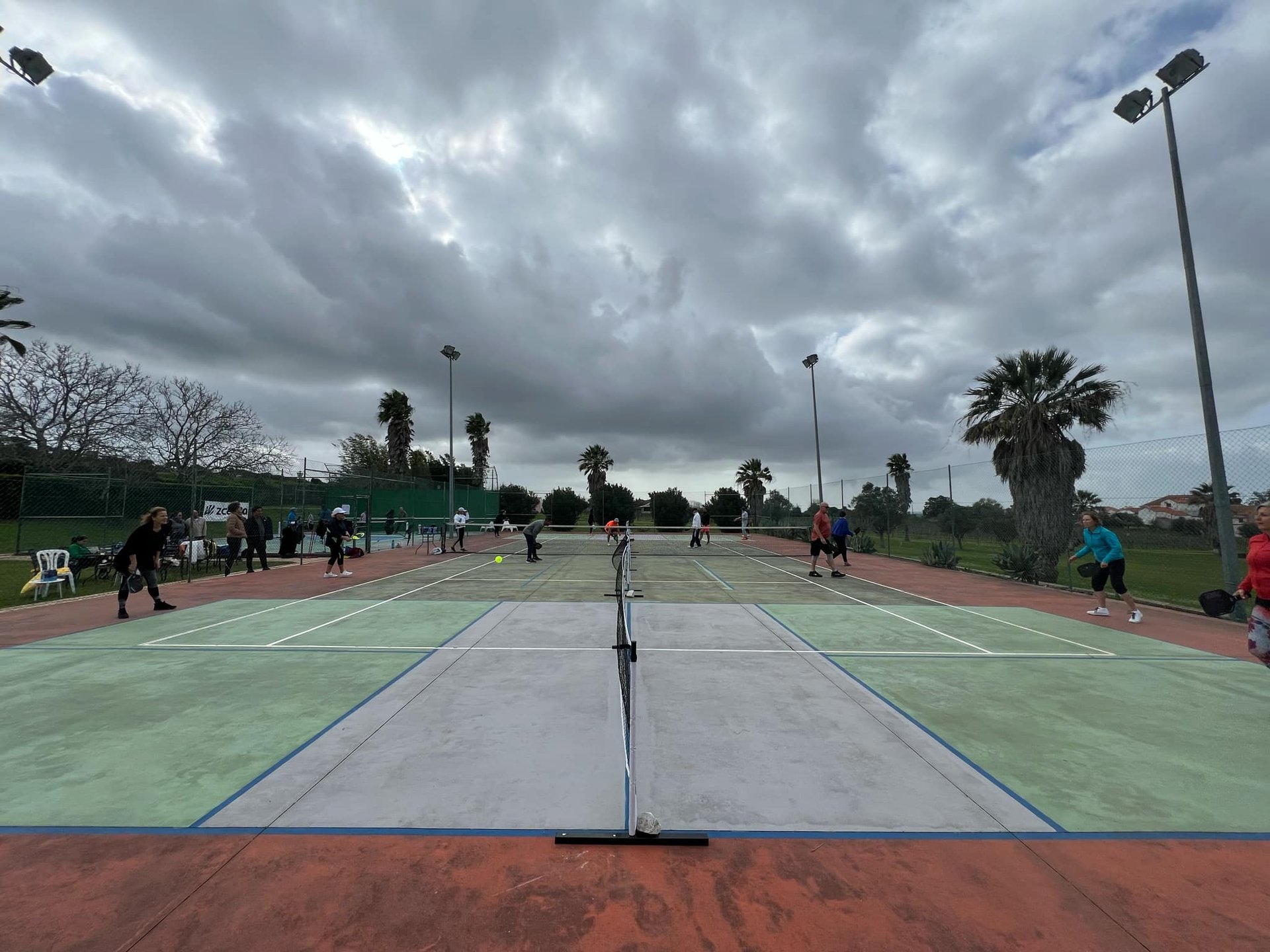 A couple of people that are holding some tennis rackets