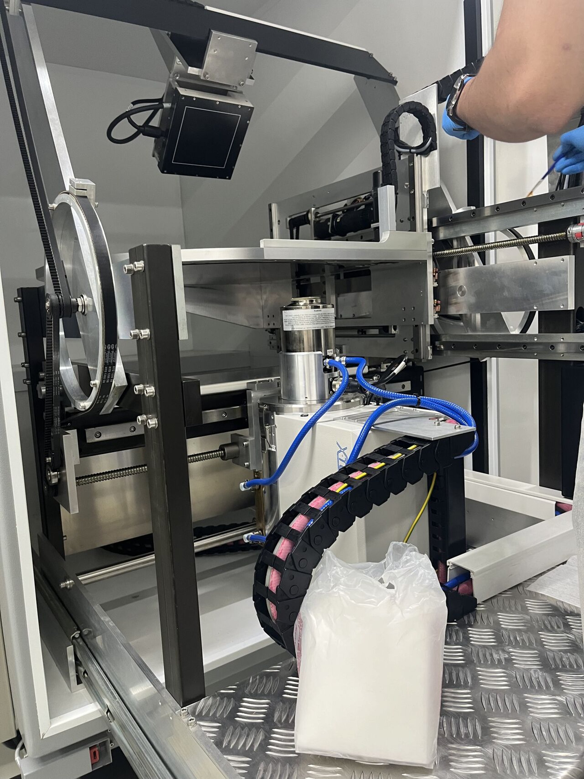 an abstract photo of a curved building with a blue sky in the background