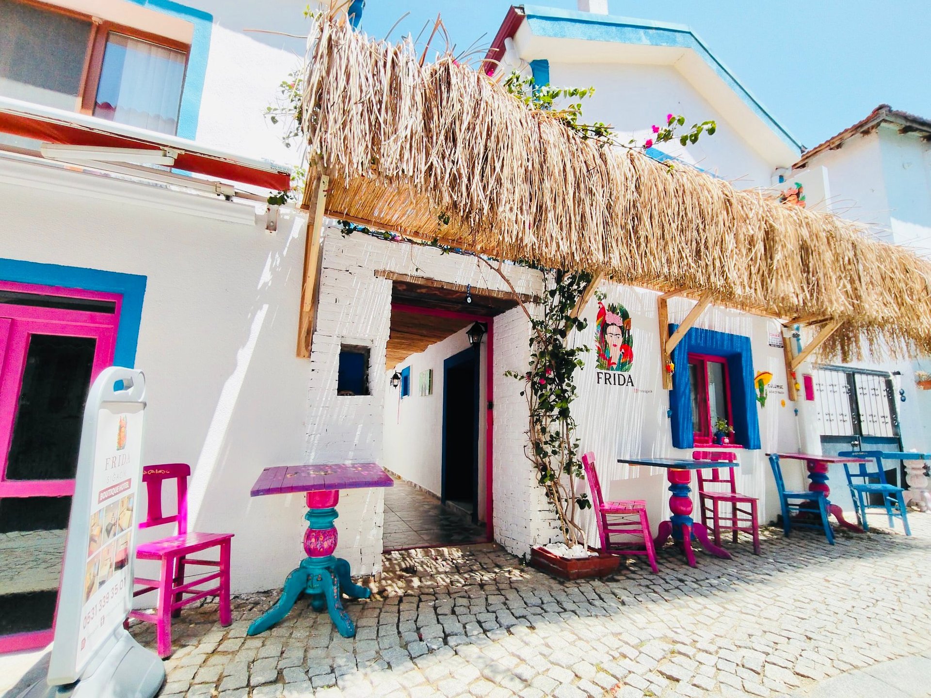 sunloungers fronting buildings near mountain