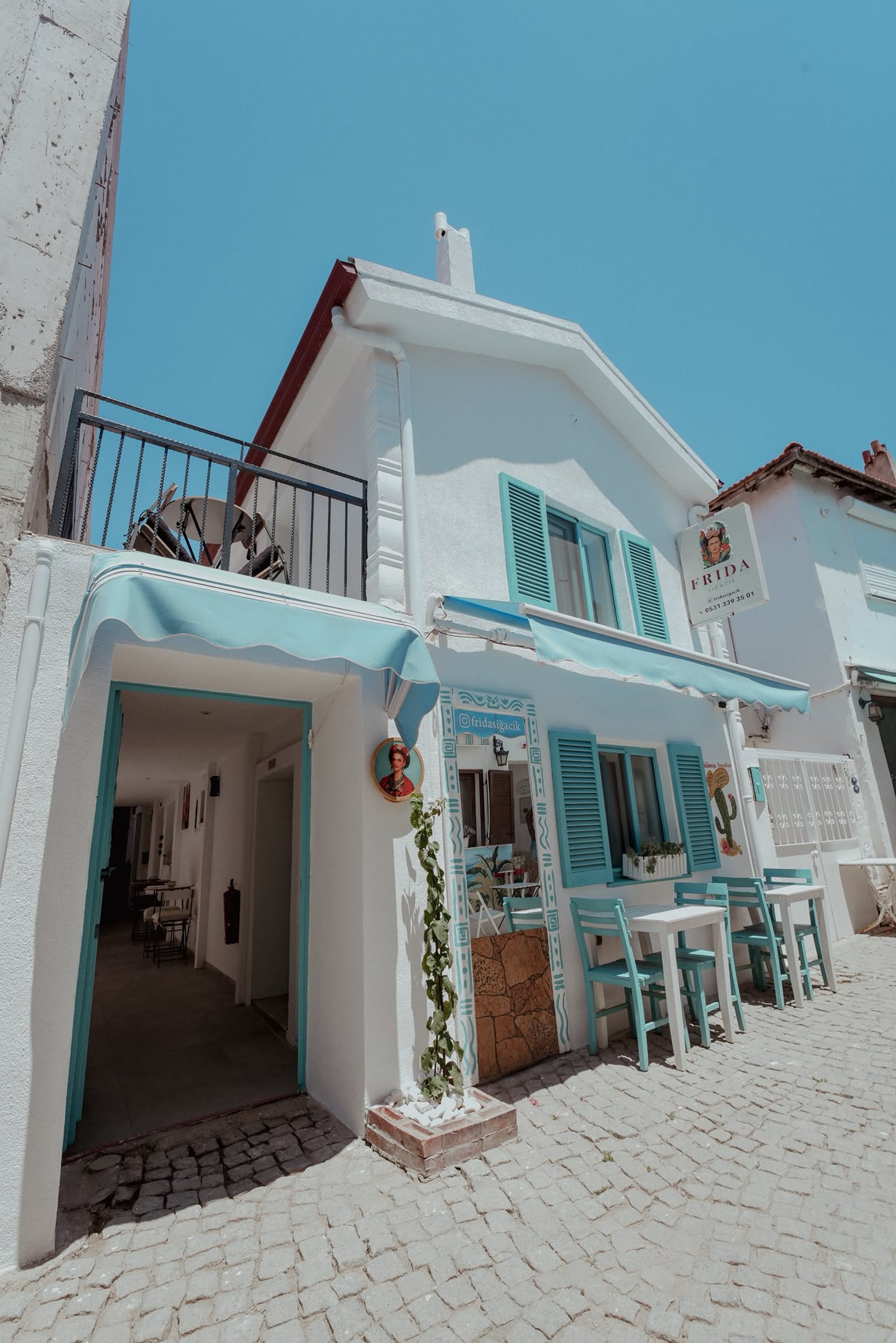 sunloungers fronting buildings near mountain