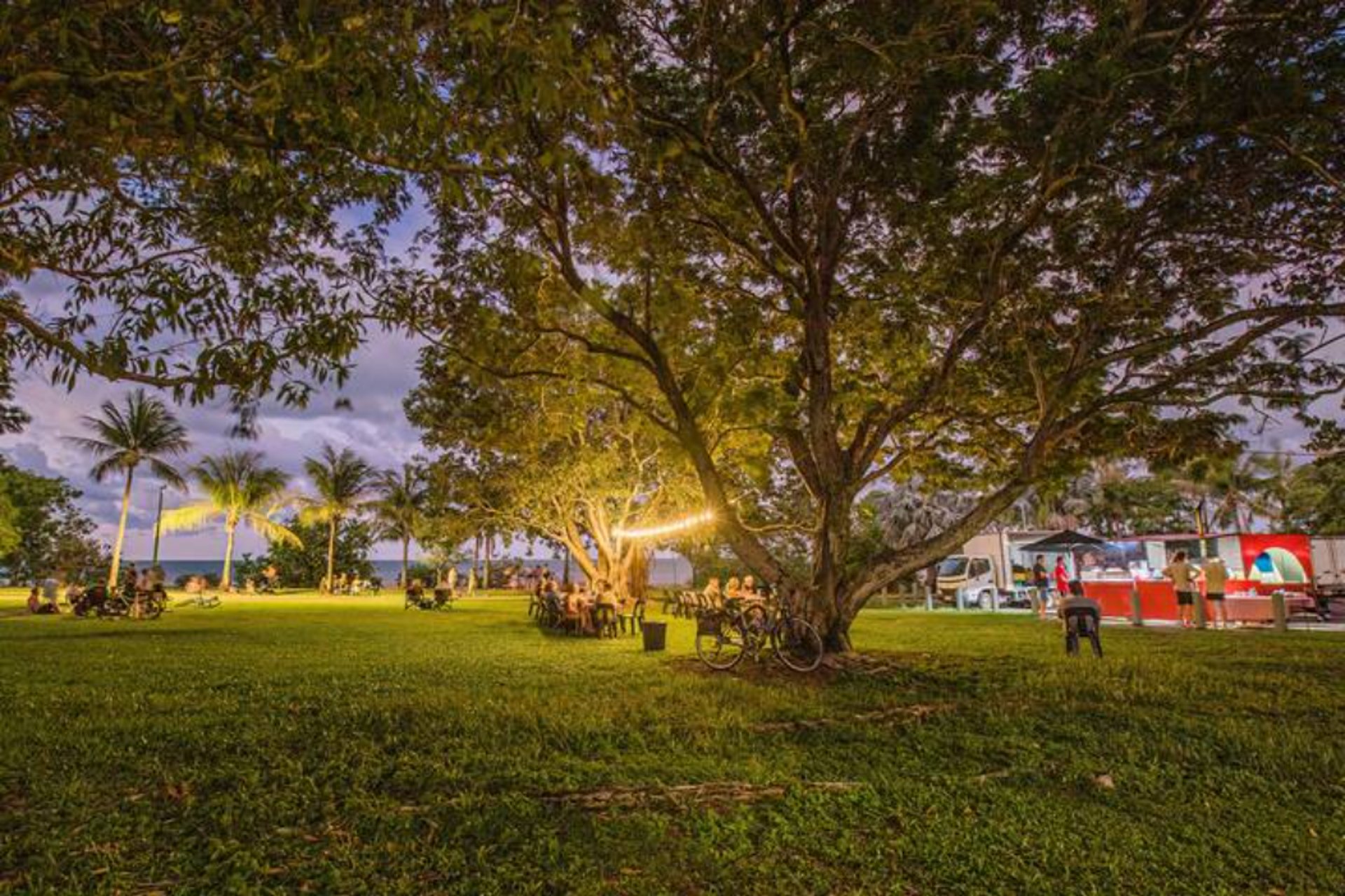 woman wearing yellow long-sleeved dress under white clouds and blue sky during daytime
