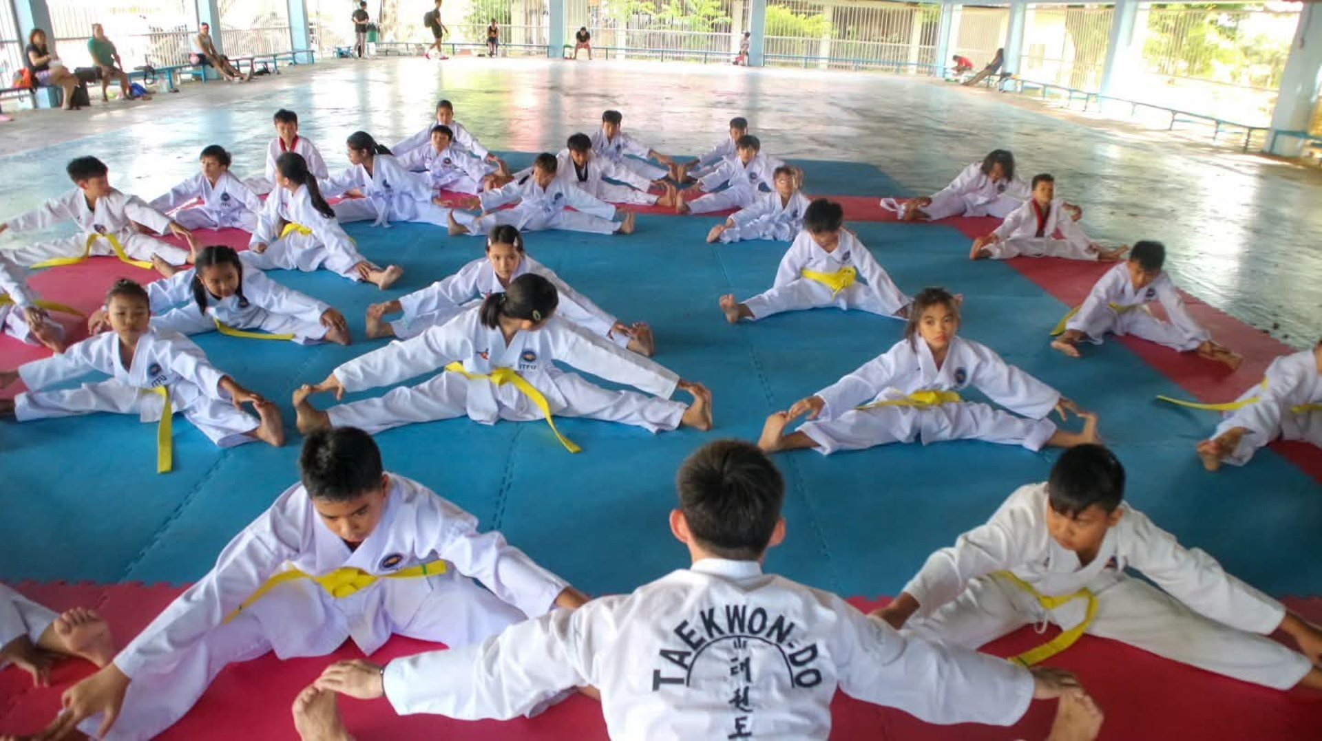 woman wearing yellow long-sleeved dress under white clouds and blue sky during daytime