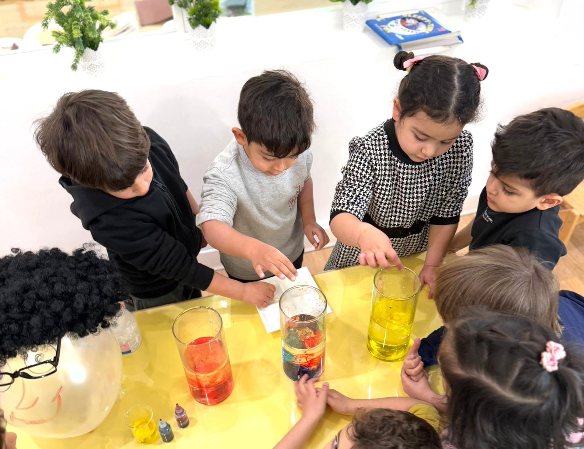 woman wearing yellow long-sleeved dress under white clouds and blue sky during daytime