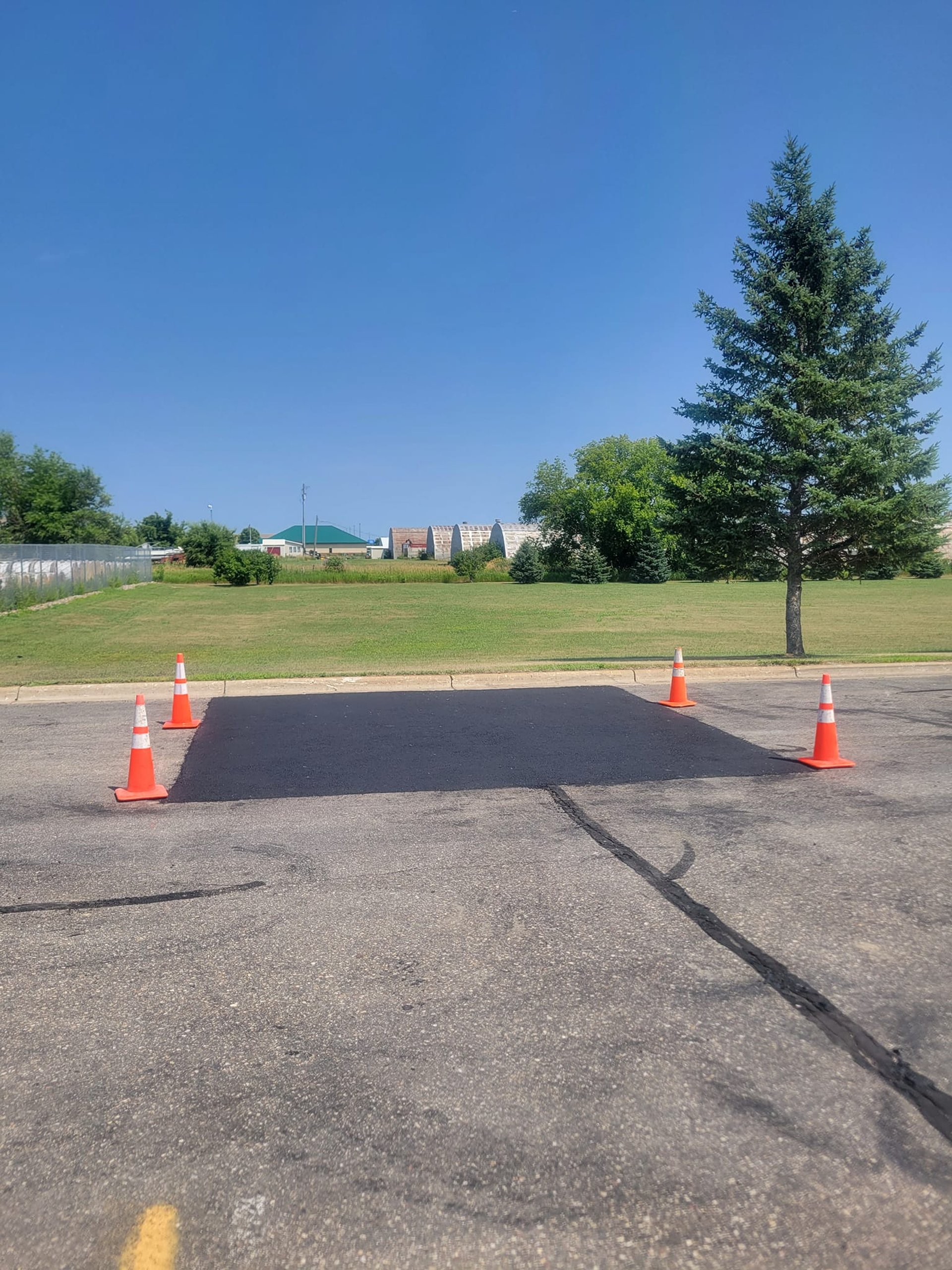 large-asphalt-repair-in-commercial-parking-lot.jpg