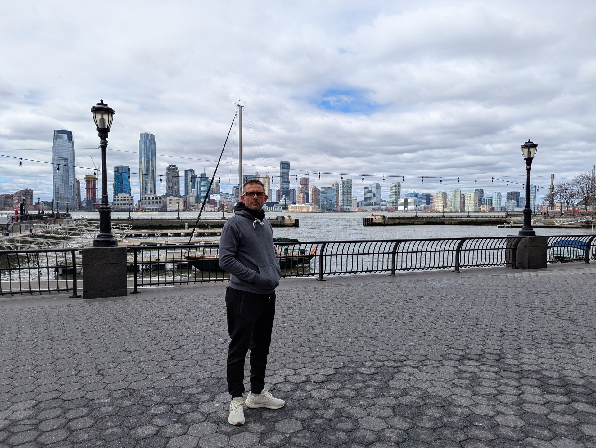 woman wearing yellow long-sleeved dress under white clouds and blue sky during daytime