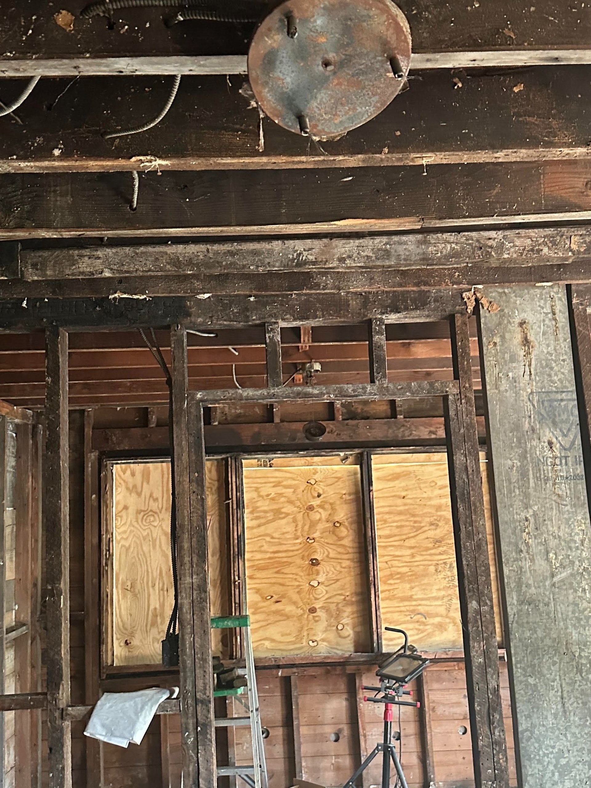 a man in a yellow uniform is using a hose