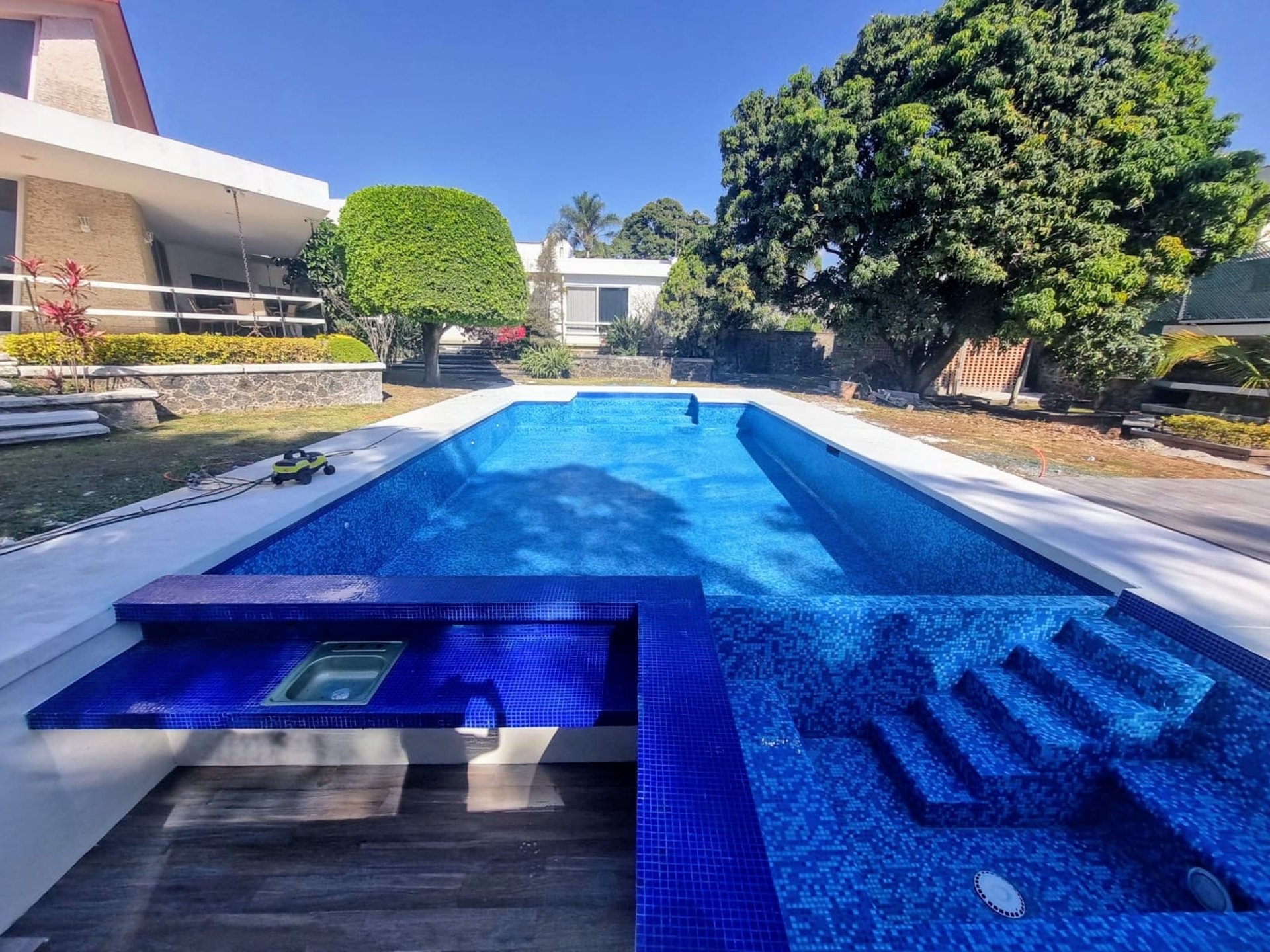 woman wearing yellow long-sleeved dress under white clouds and blue sky during daytime