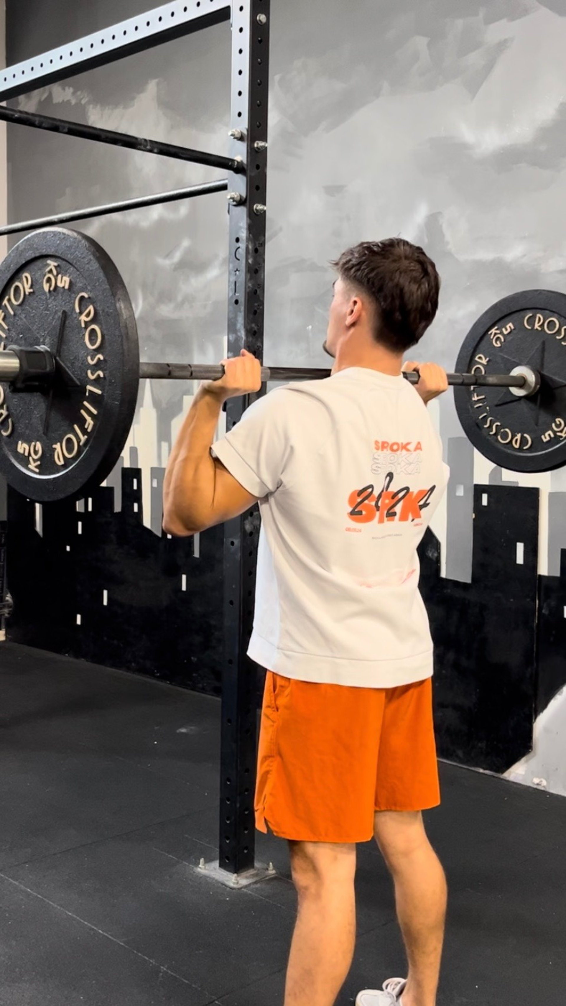 person holding the barbell