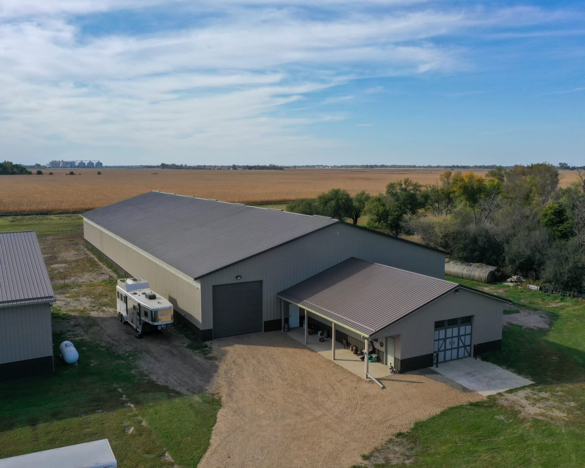 a porch with two chairs and a table on it
