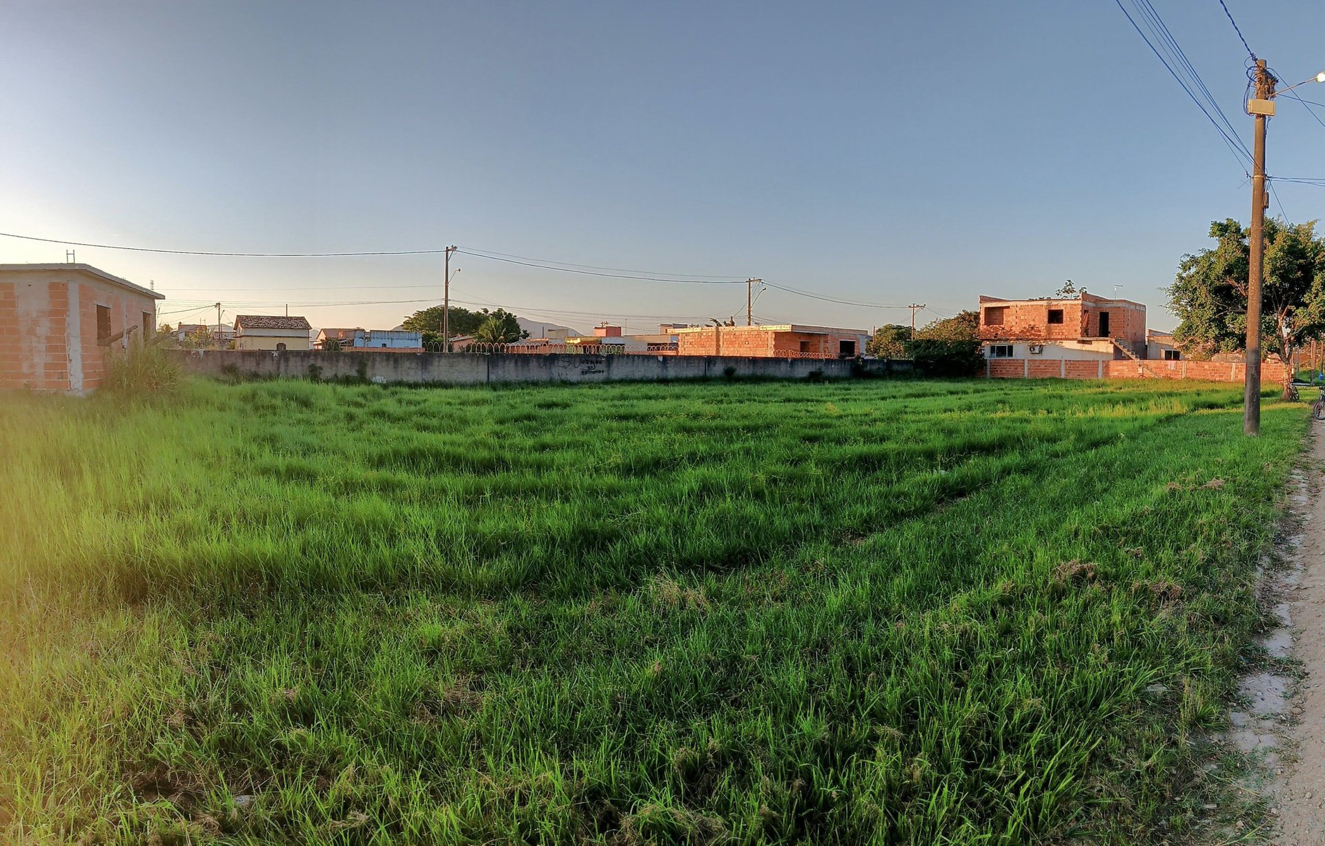 woman wearing yellow long-sleeved dress under white clouds and blue sky during daytime