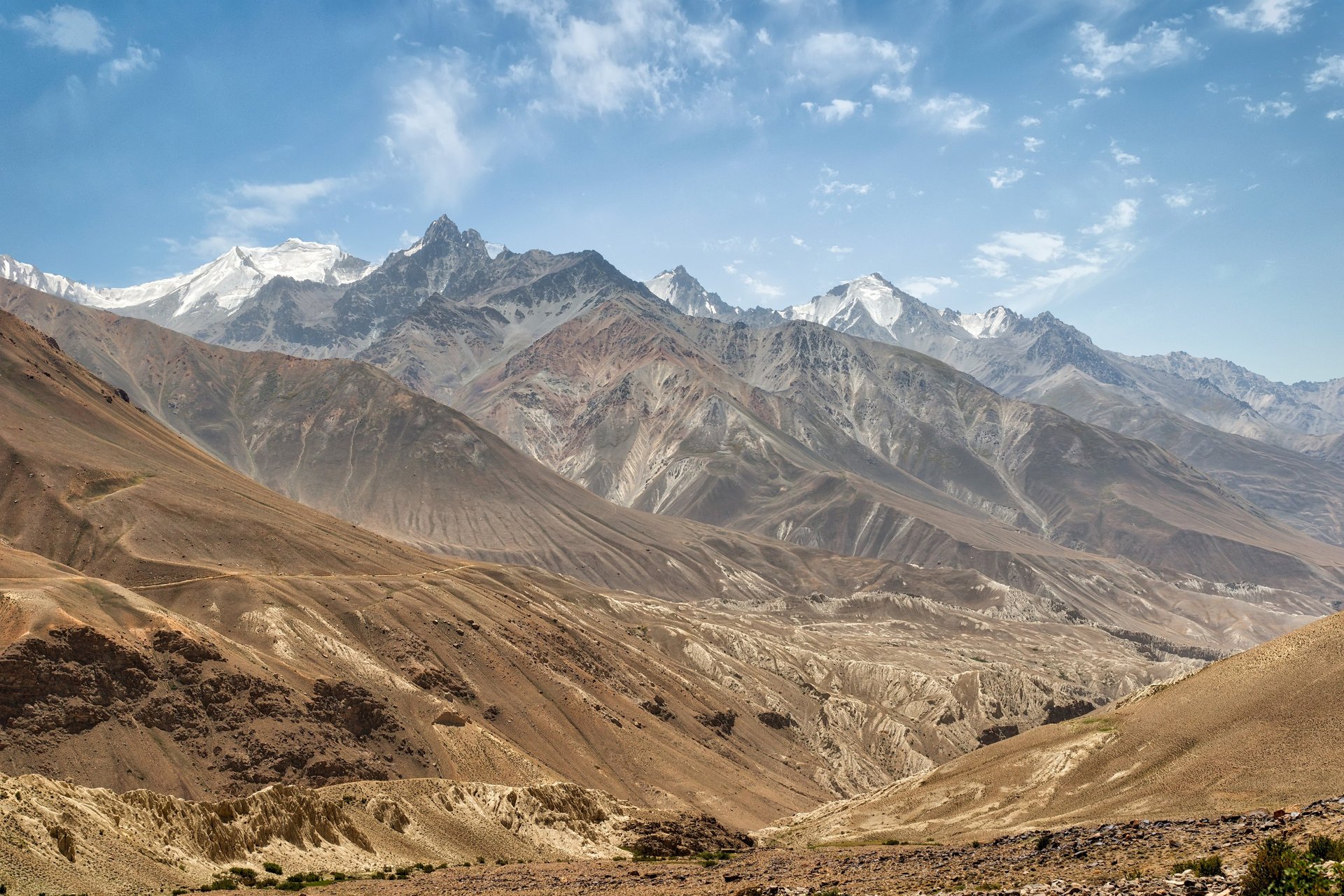 a view of a city with mountains in the background
