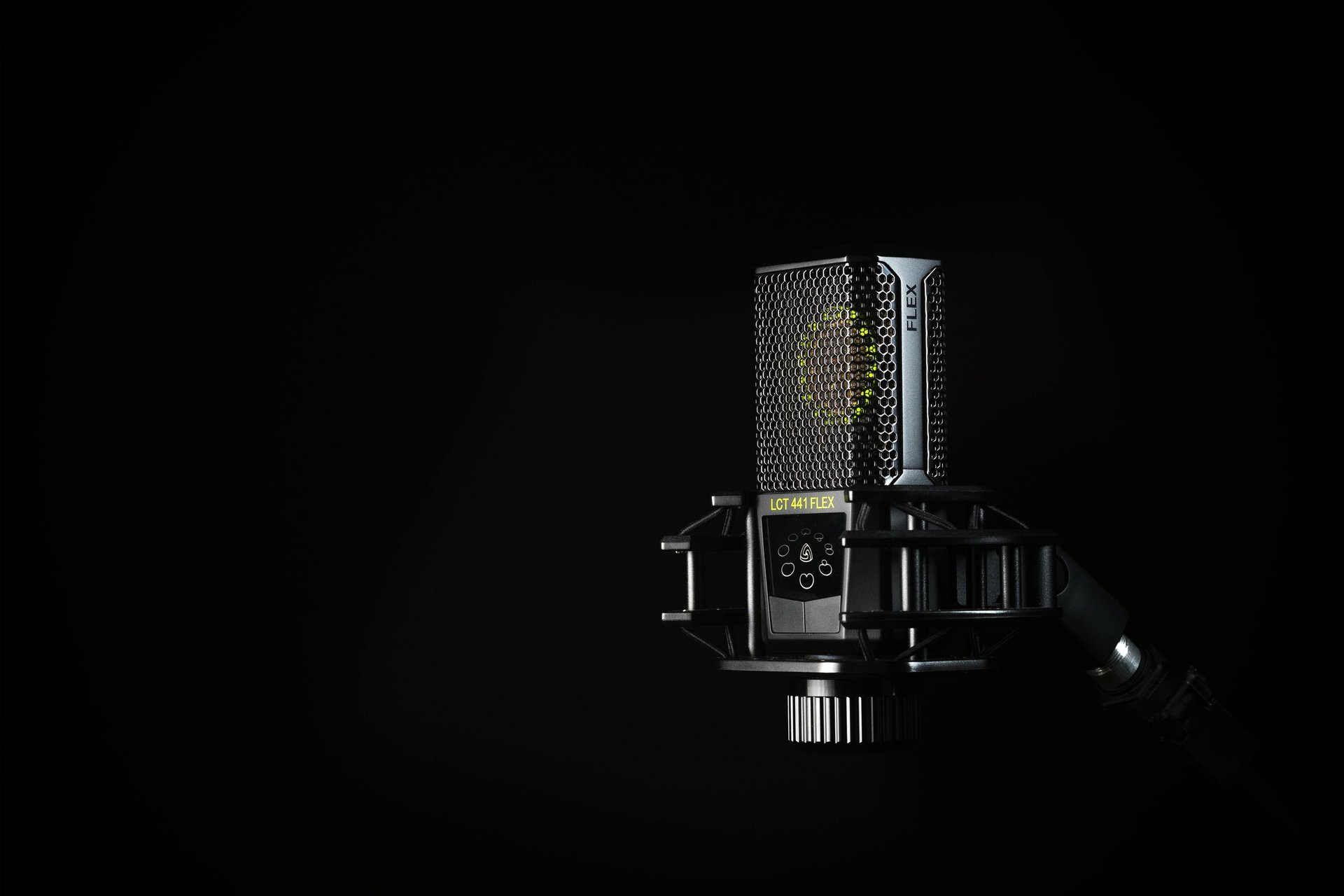 a microphone on a stand in a dark room