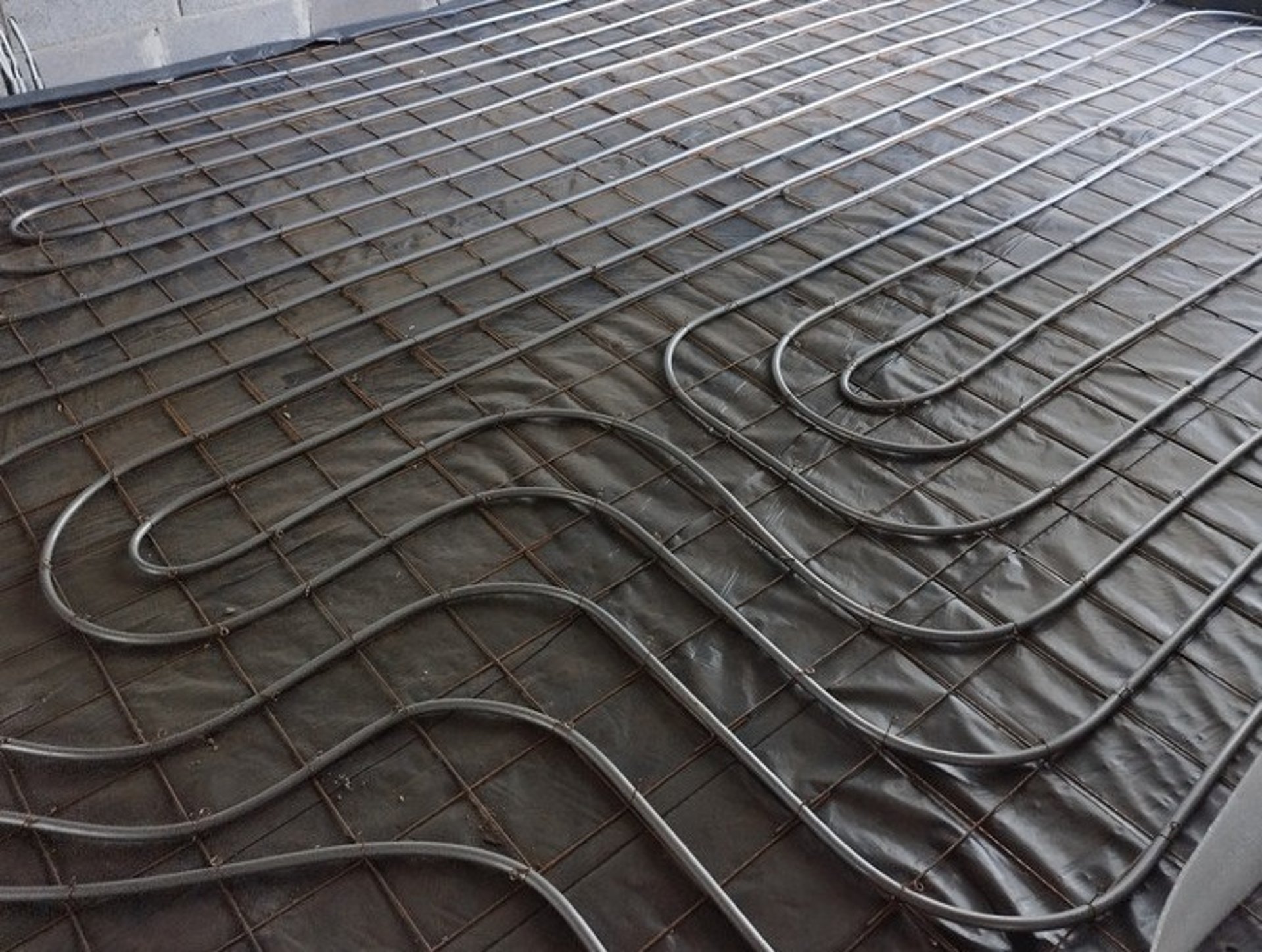 a close up of a bunch of pipes on a wall