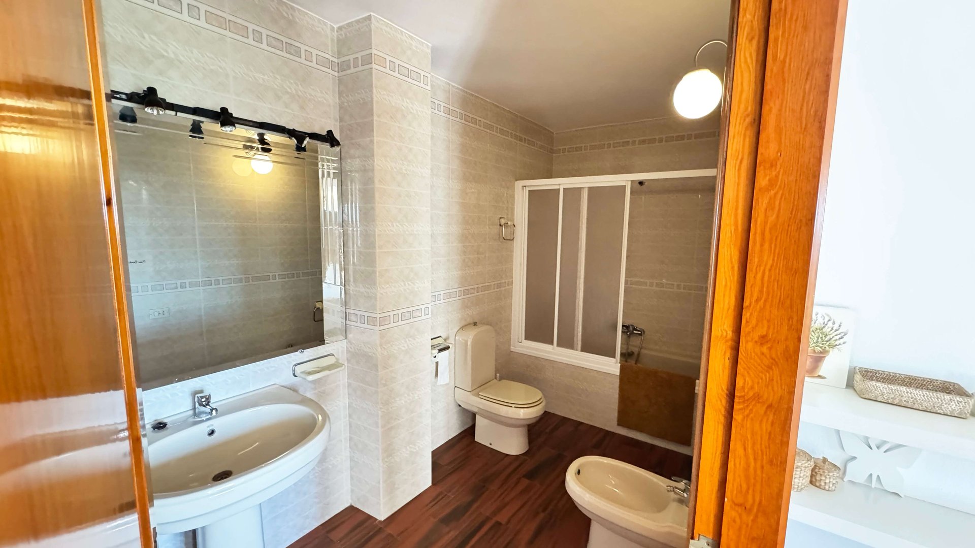 an abstract photo of a curved building with a blue sky in the background