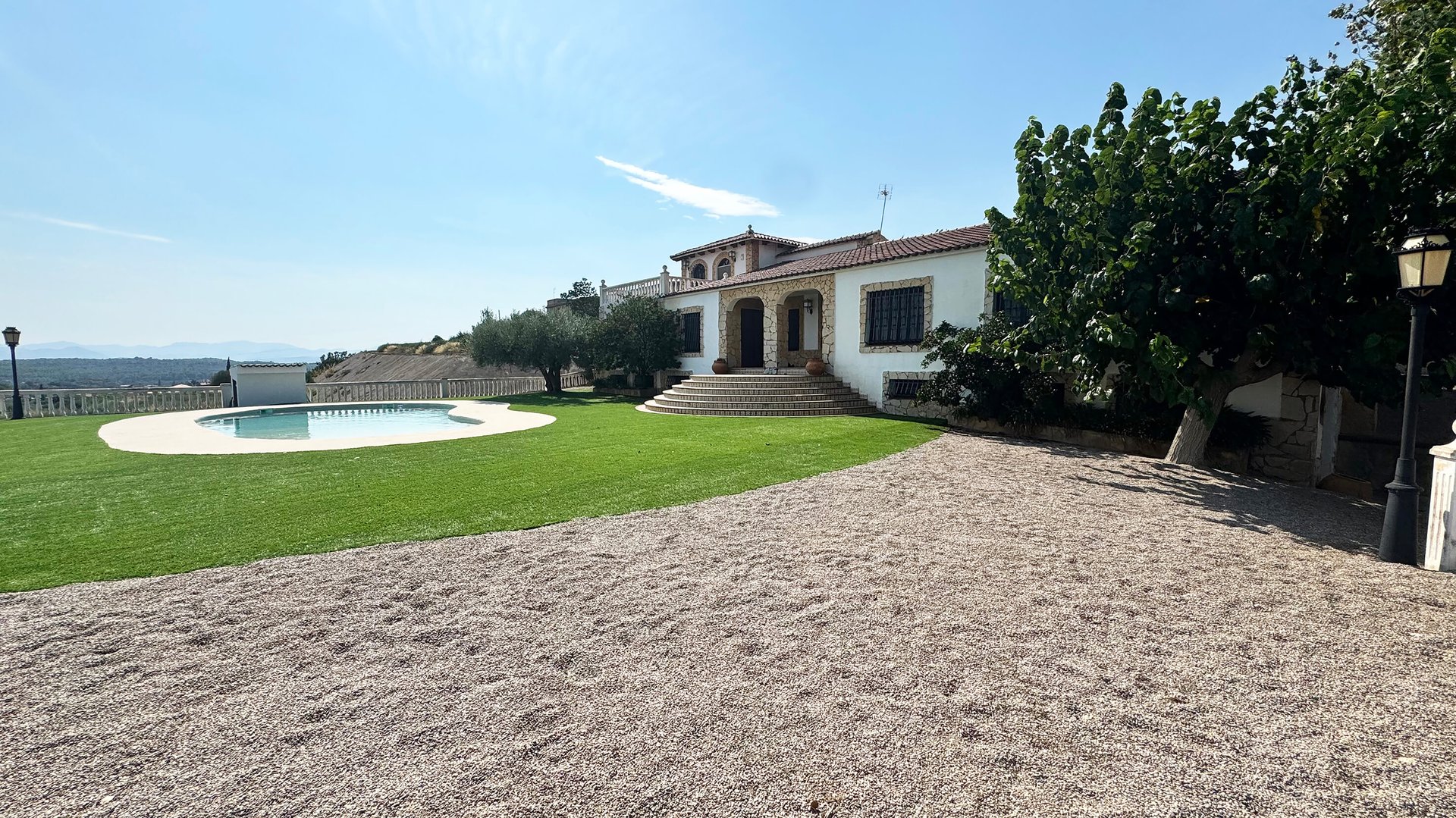 an abstract photo of a curved building with a blue sky in the background