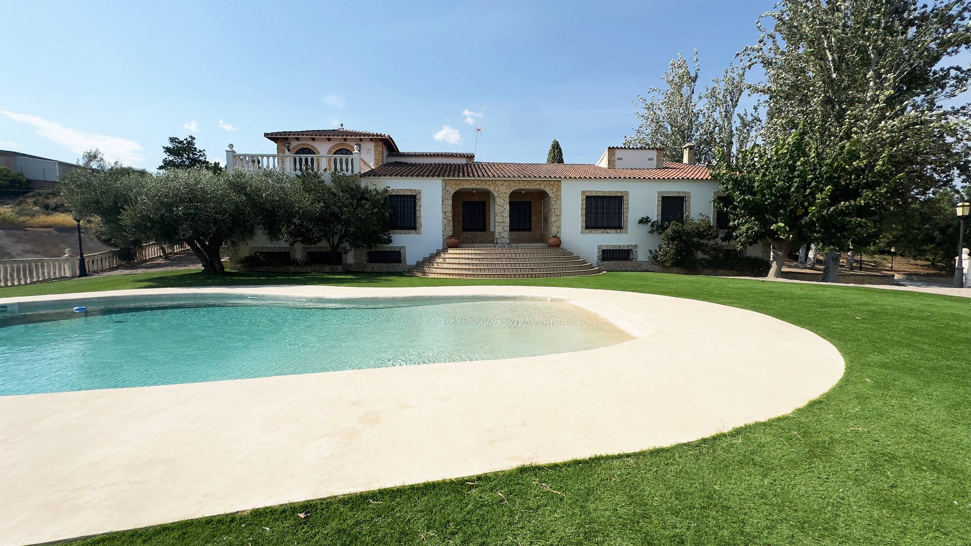 an abstract photo of a curved building with a blue sky in the background