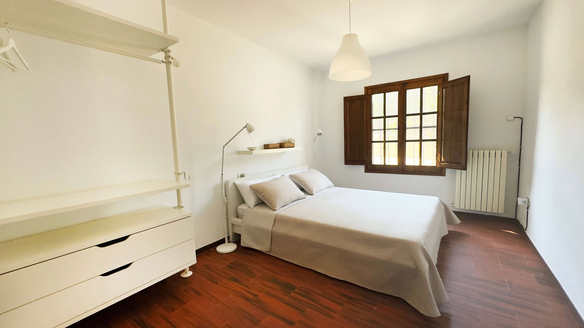 an abstract photo of a curved building with a blue sky in the background