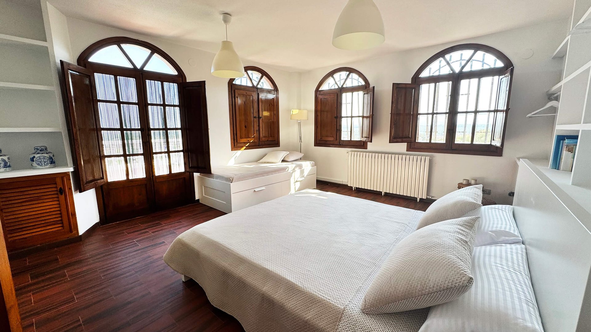 an abstract photo of a curved building with a blue sky in the background