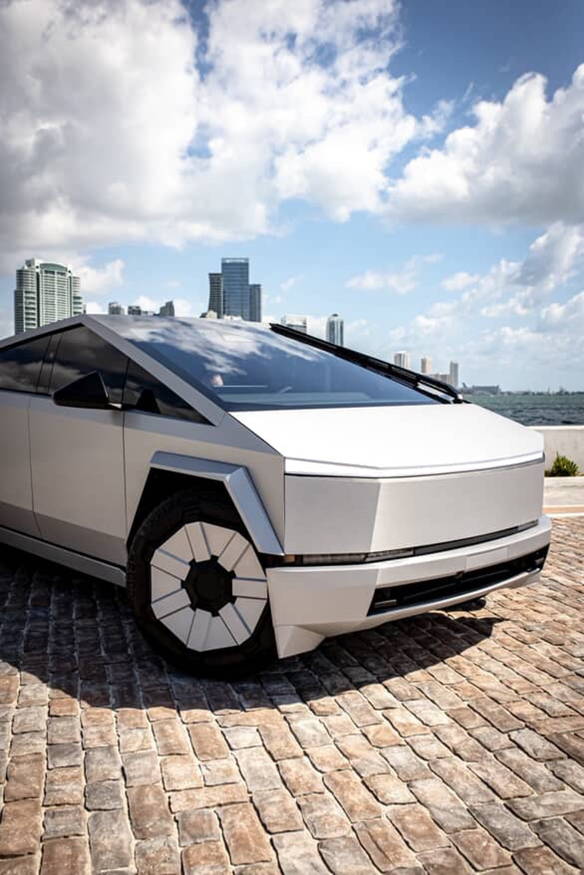 A futuristic car is parked in a parking lot
