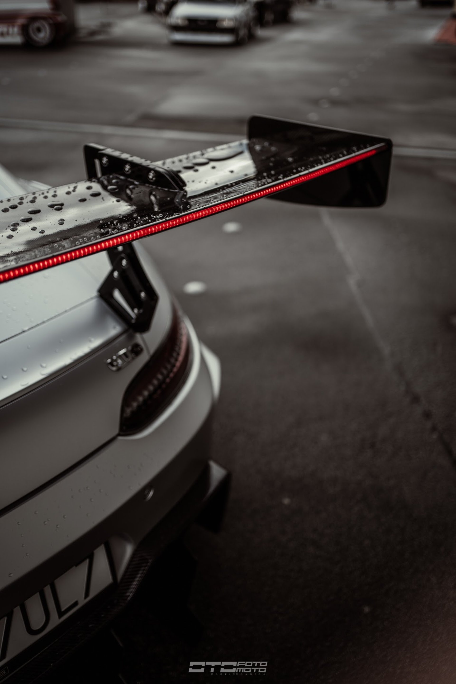 a black sports car parked in front of a building
