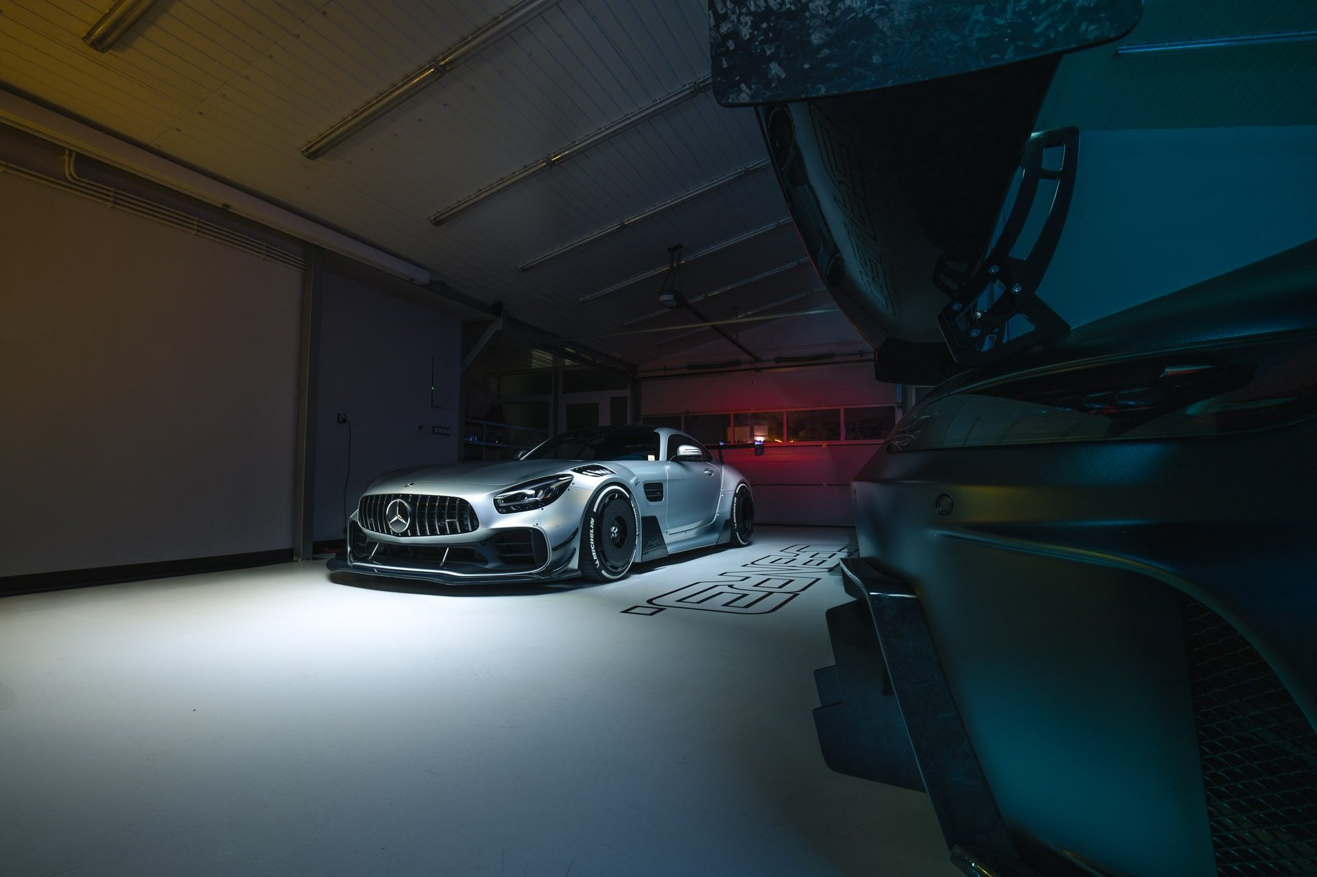 an abstract photo of a curved building with a blue sky in the background