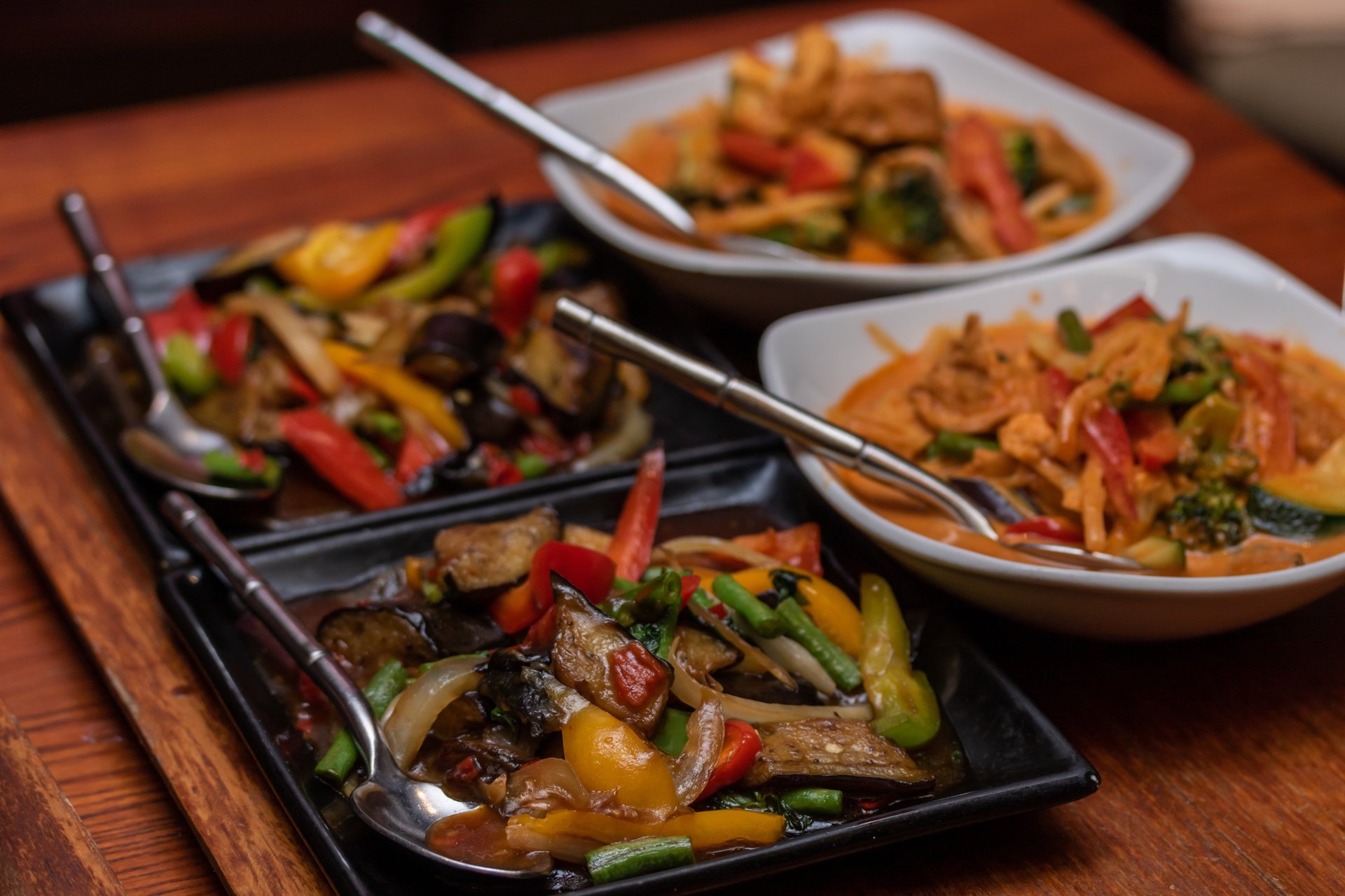 an abstract photo of a curved building with a blue sky in the background