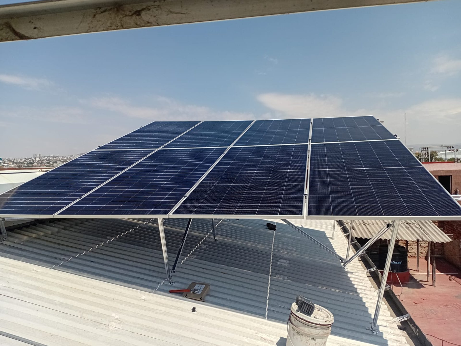 an abstract photo of a curved building with a blue sky in the background