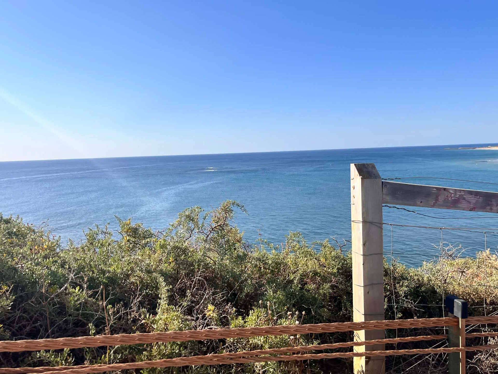 an aerial view of a sandy beach and ocean