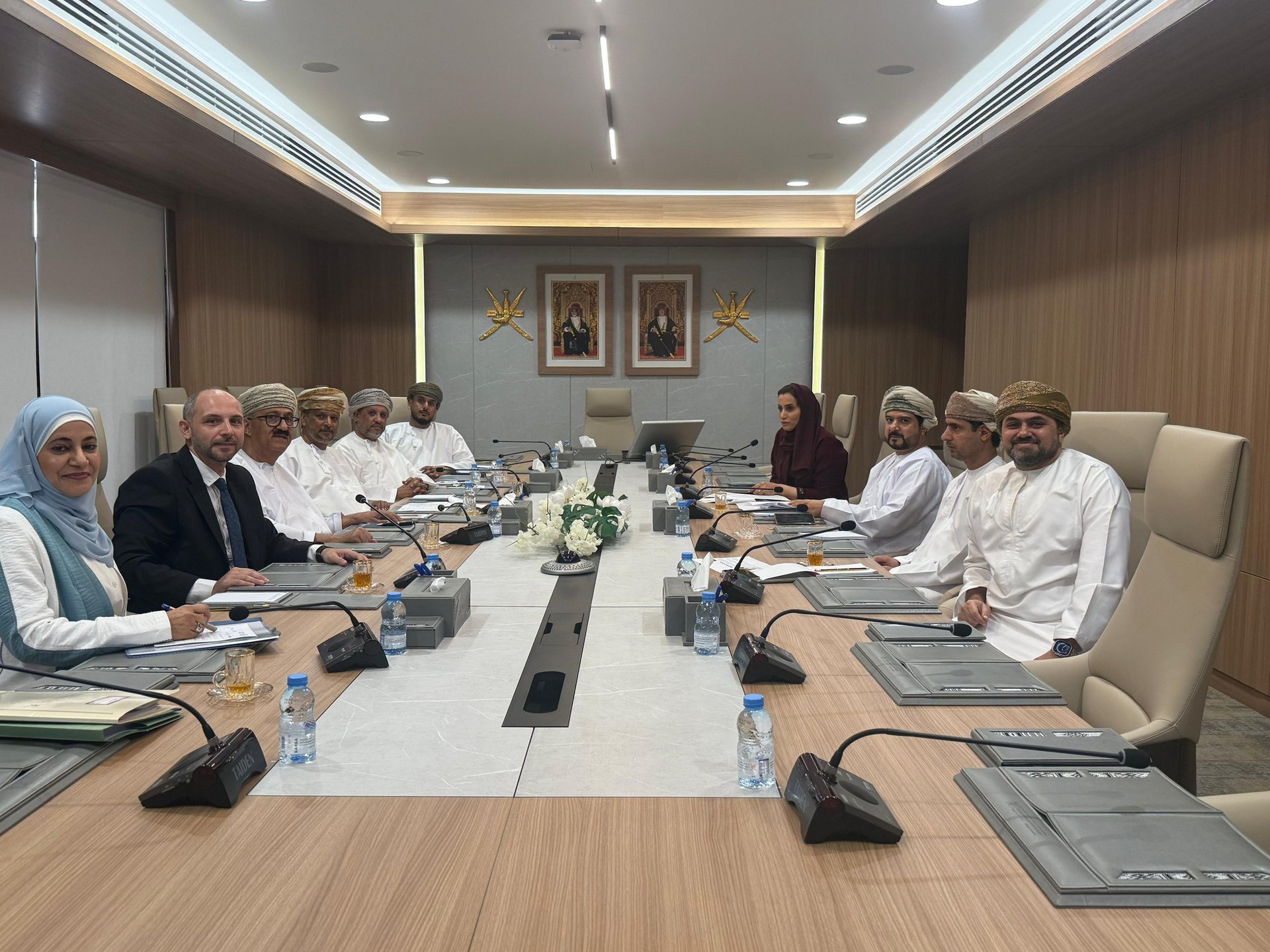an abstract photo of a curved building with a blue sky in the background