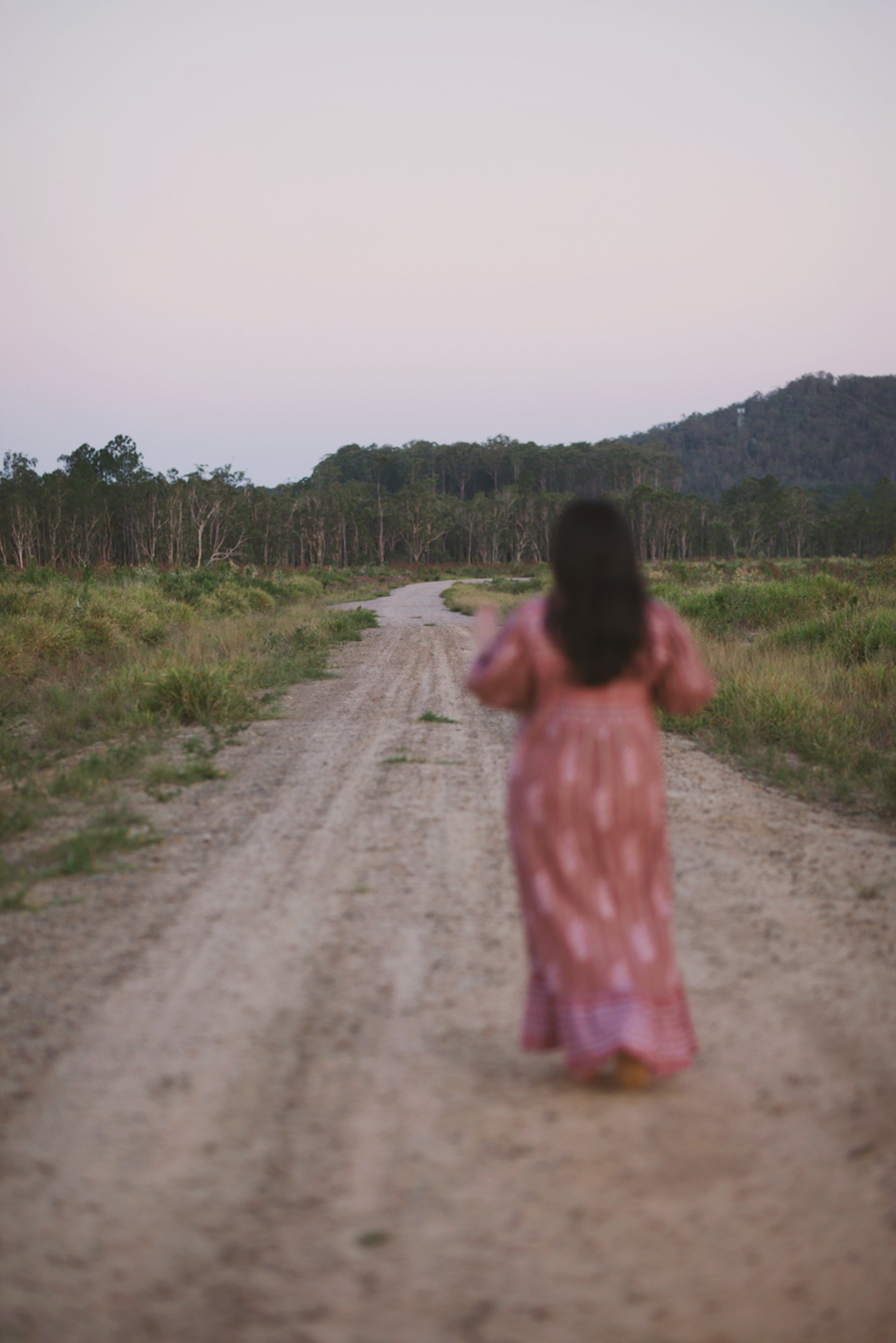 an abstract photo of a curved building with a blue sky in the background