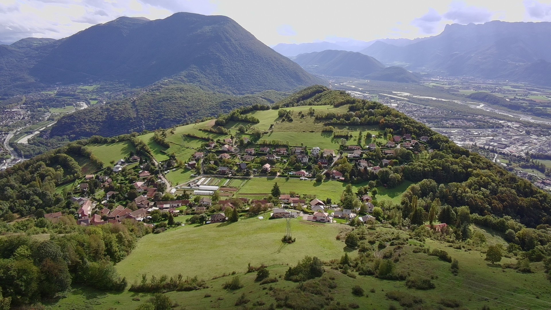 a view of a mountain with trees in the foreground