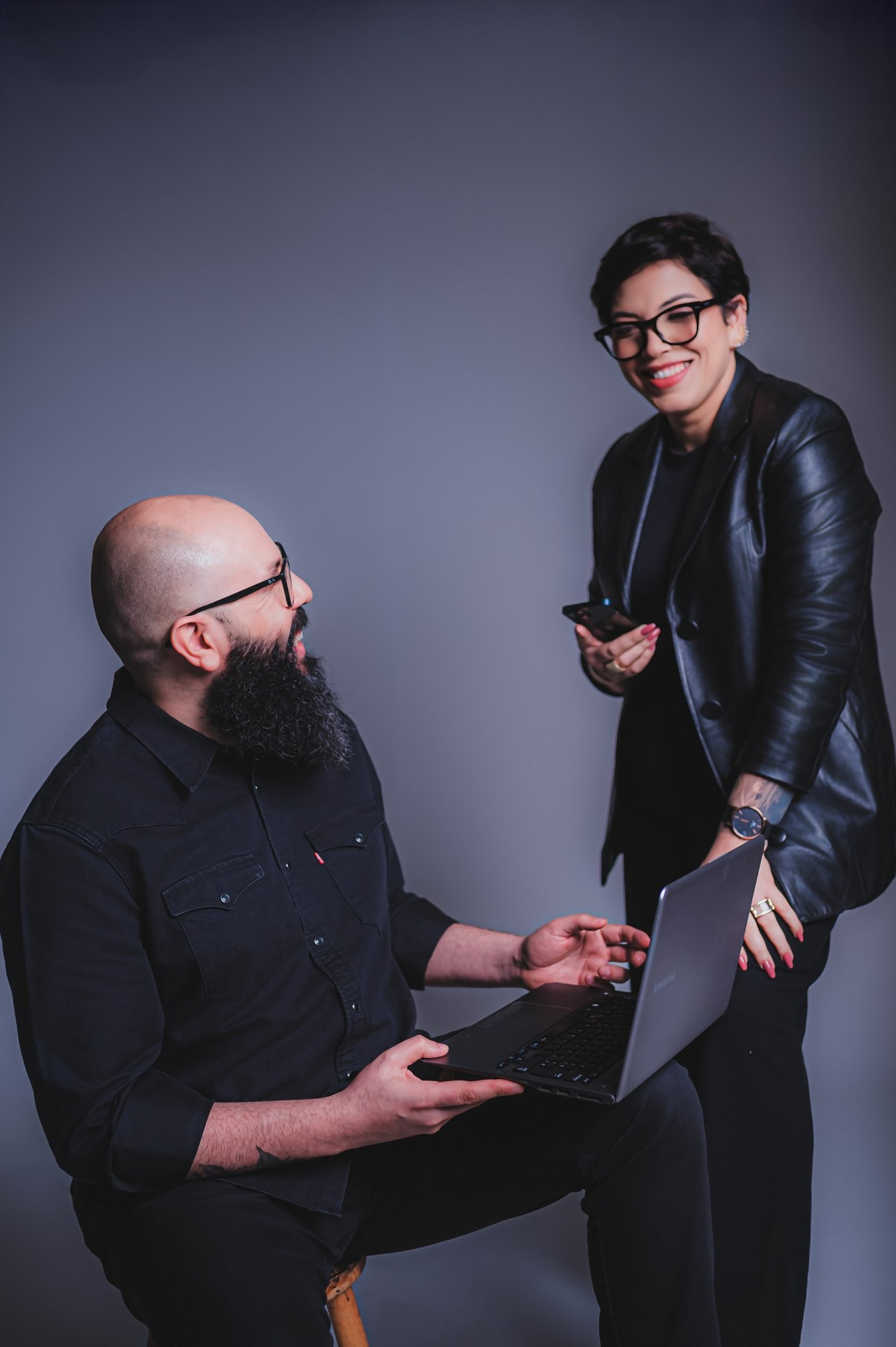 a close up of a black and brown abstract painting