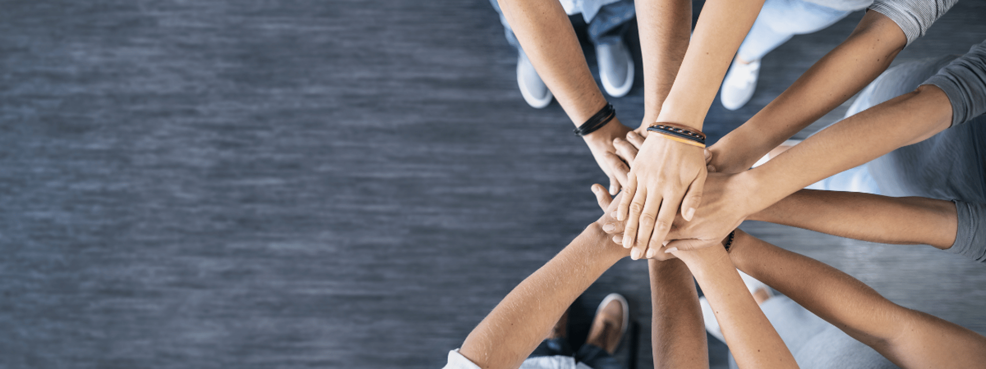 person in black long sleeve shirt holding persons hand