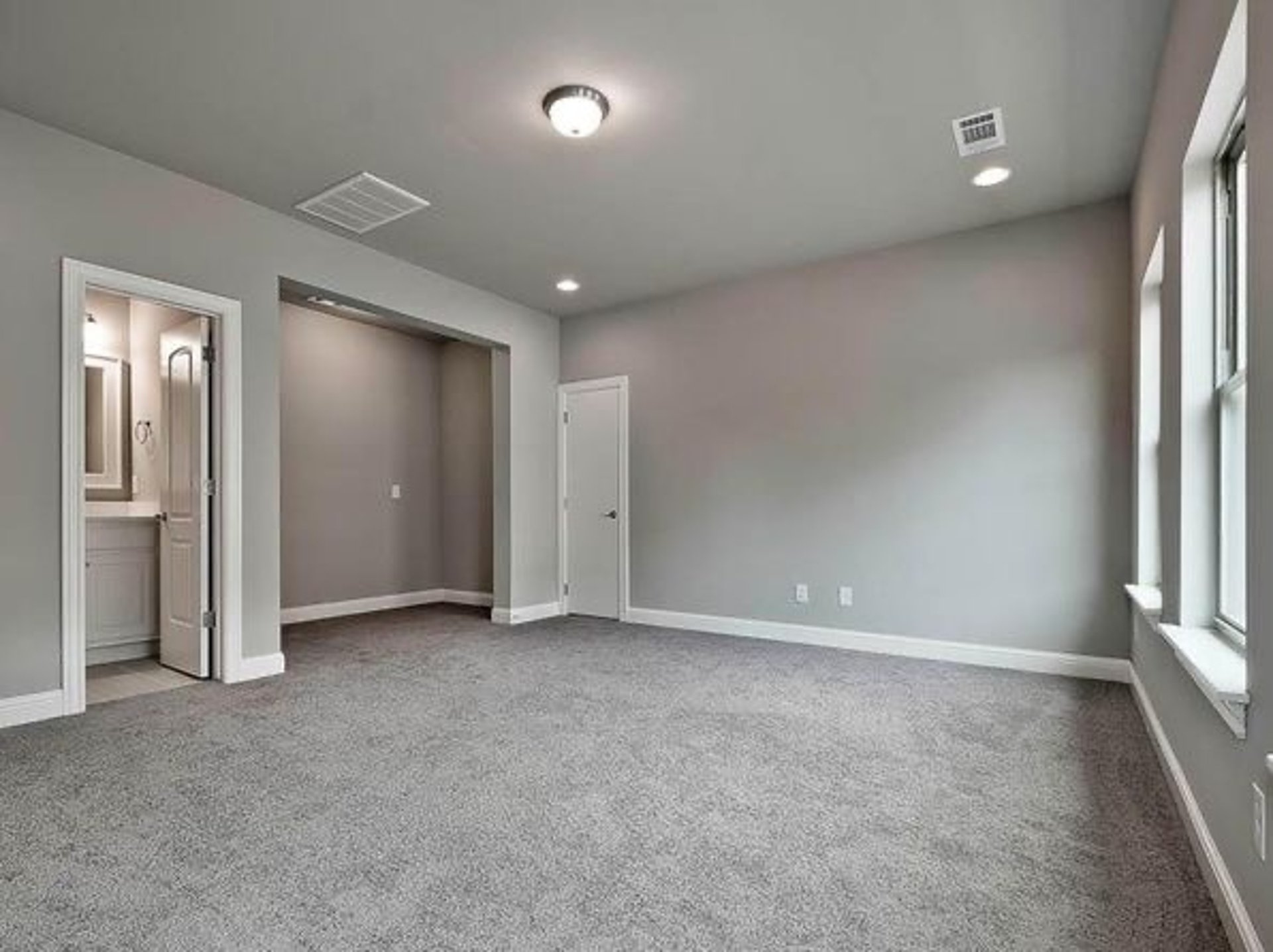 an abstract photo of a curved building with a blue sky in the background