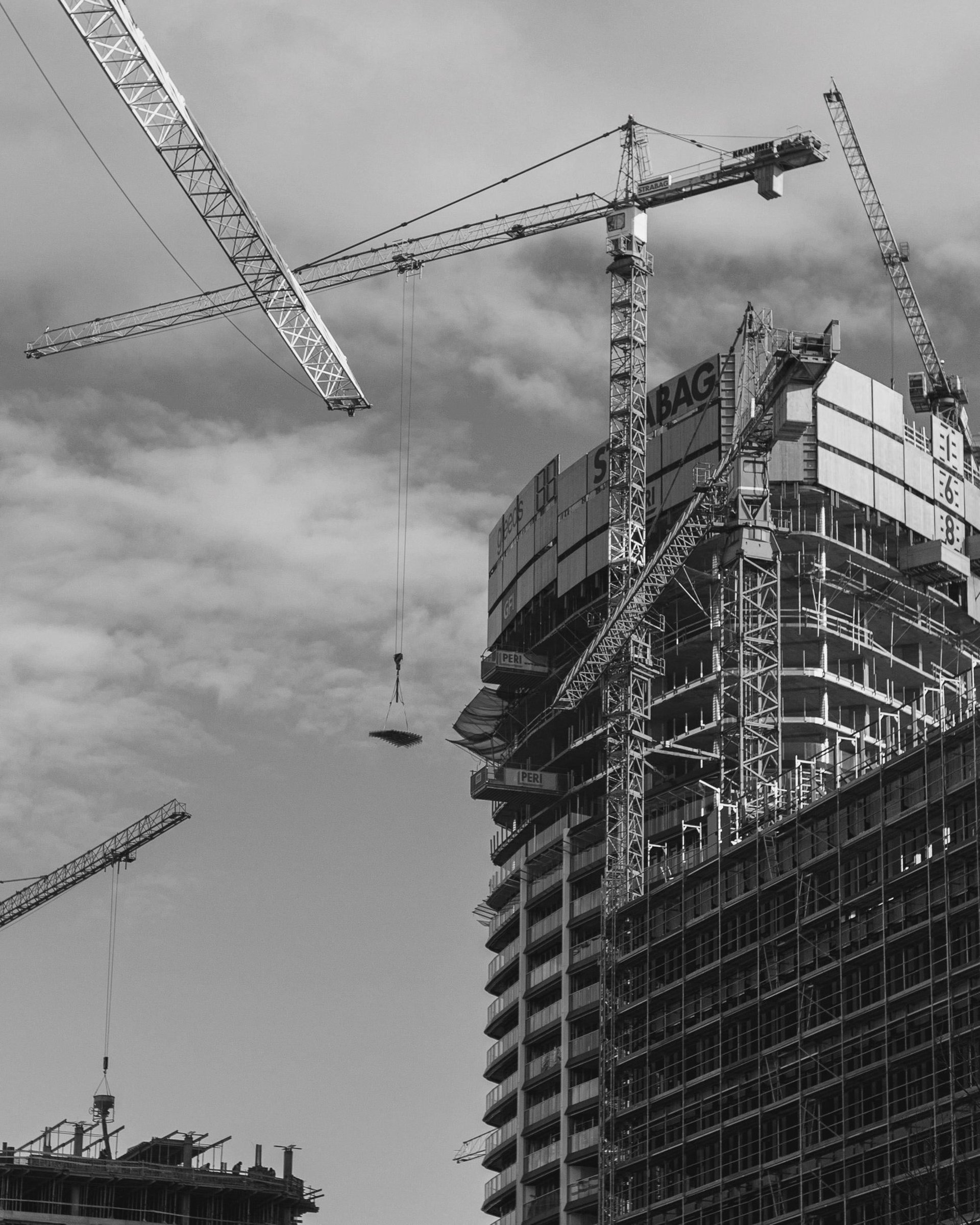 brown and white wooden house near green trees during daytime