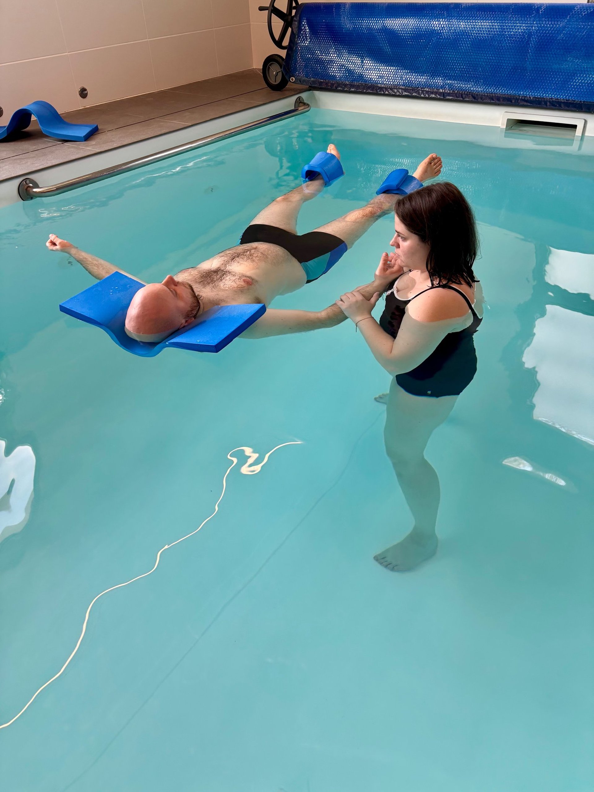 an abstract photo of a curved building with a blue sky in the background