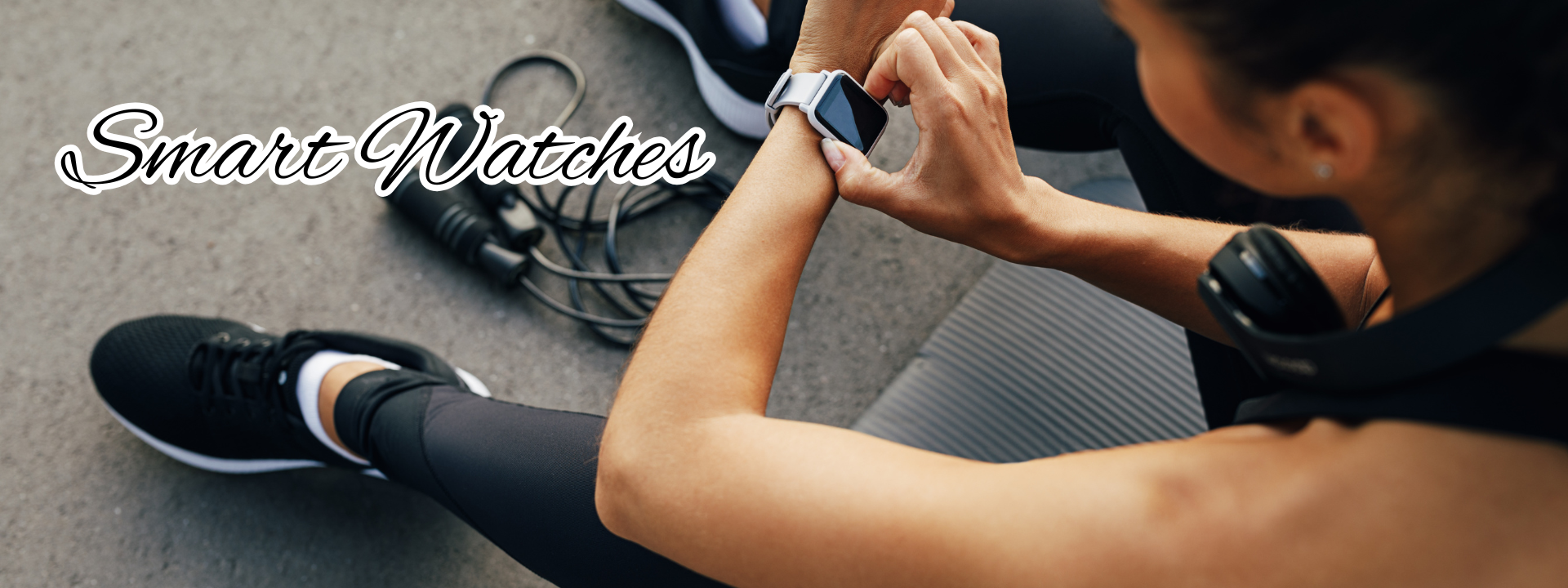 a black watch with a red face on a white surface