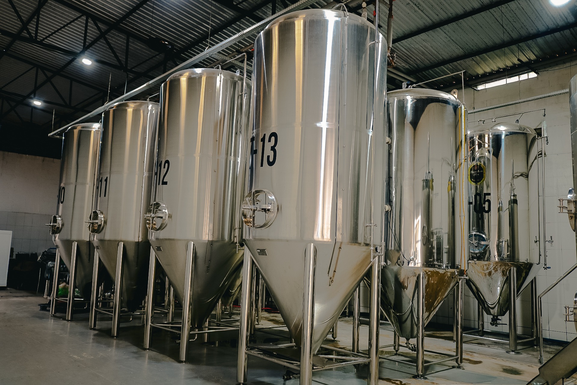an abstract photo of a curved building with a blue sky in the background